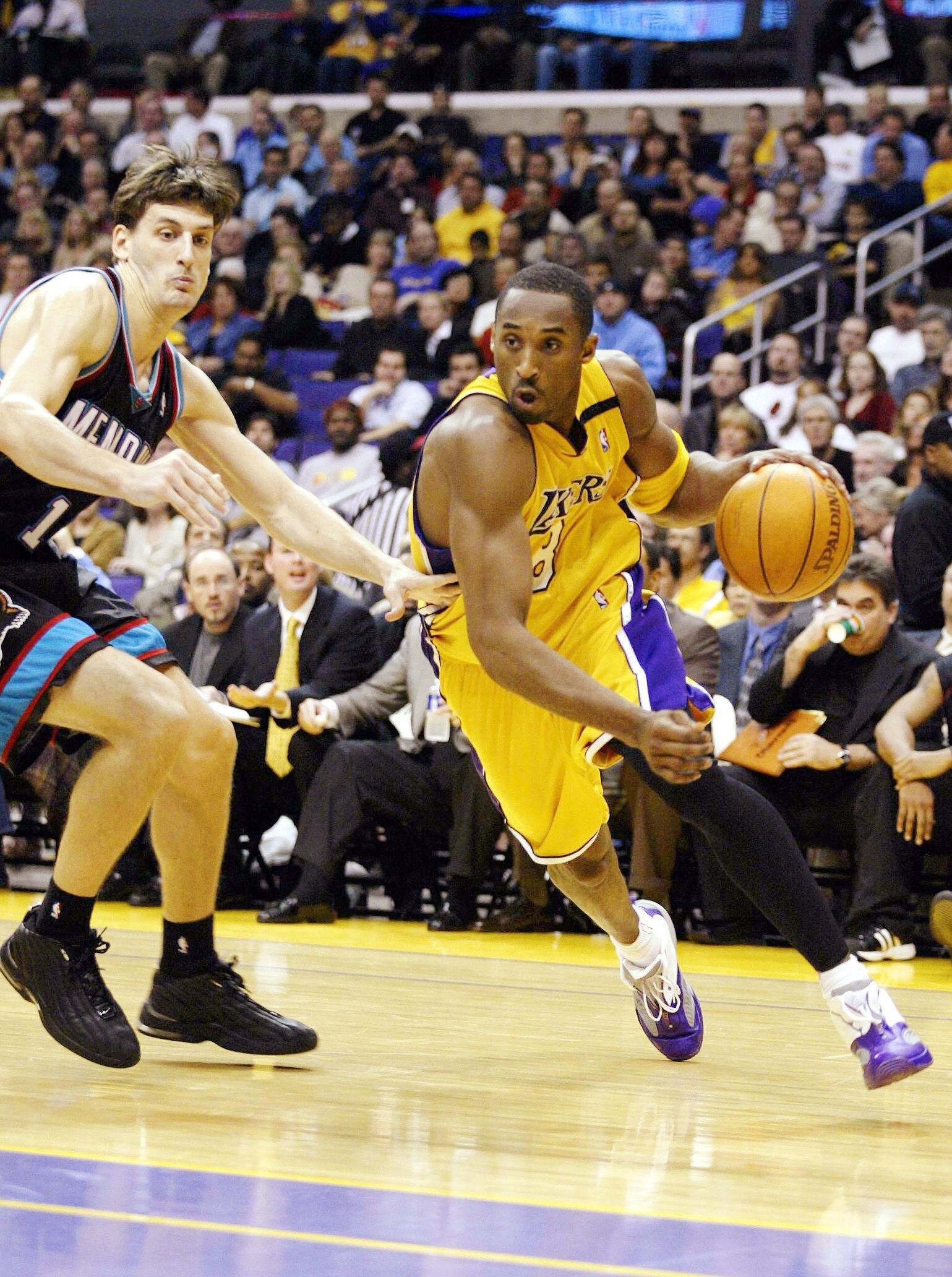 LOS ANGELES, CA - DECEMBER 3:  Kobe Bryant #8 of the Los Angeles Lakers drives past Gordan Giricek #10 of the Memphis Grizzlies on December 3, 2002 at Staples Center in Los Angeles, California.  NOTE TO USER: User expressly acknowledges and agrees that, b