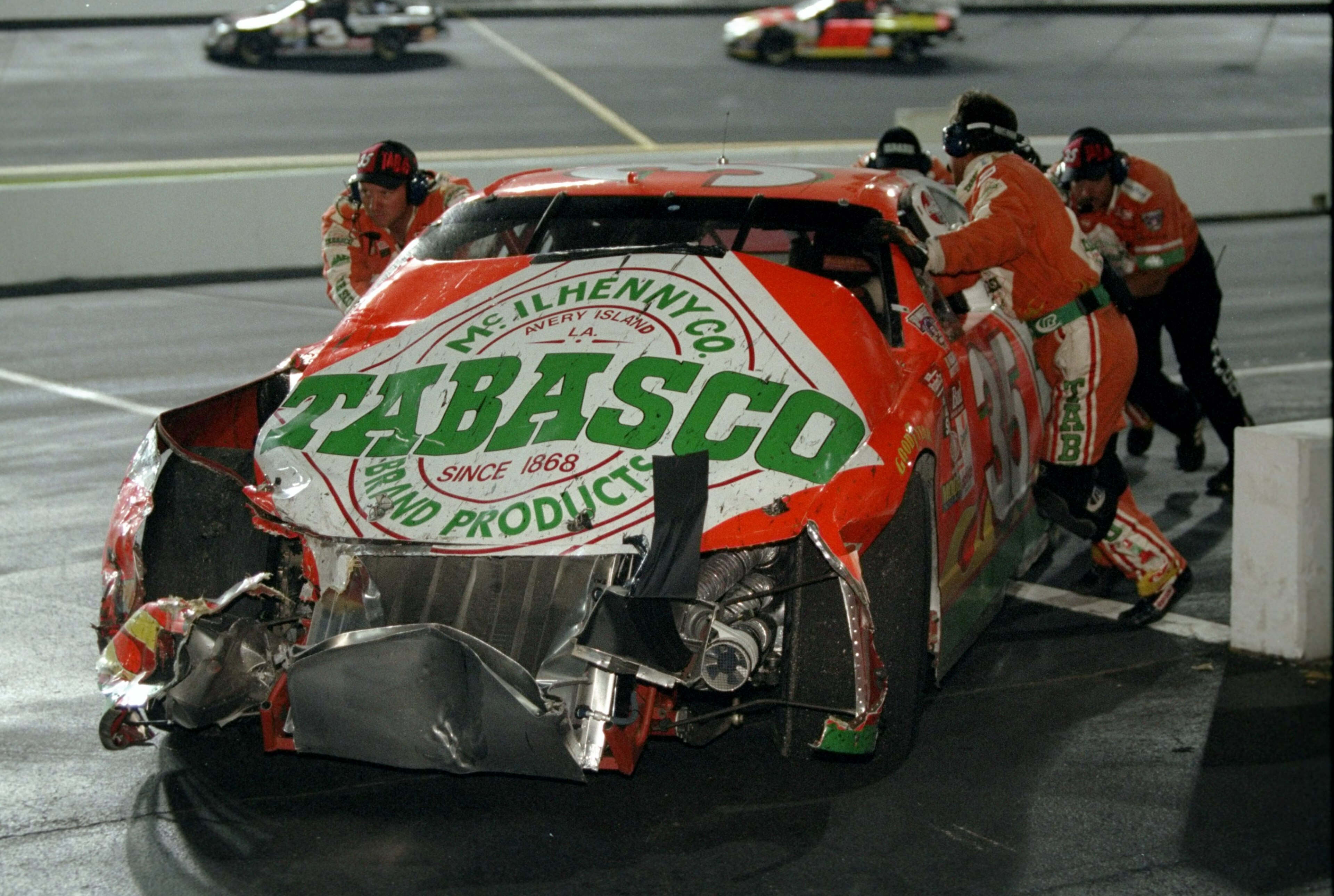 6 Jun 1998:  The crew of driver Todd Bodine work to get his car back to the pits after a collision during the Pontiac Excitement 400 at the Richmond International Speedway in Richmond, Virginia. Mandatory Credit: Craig Jones  /Allsport