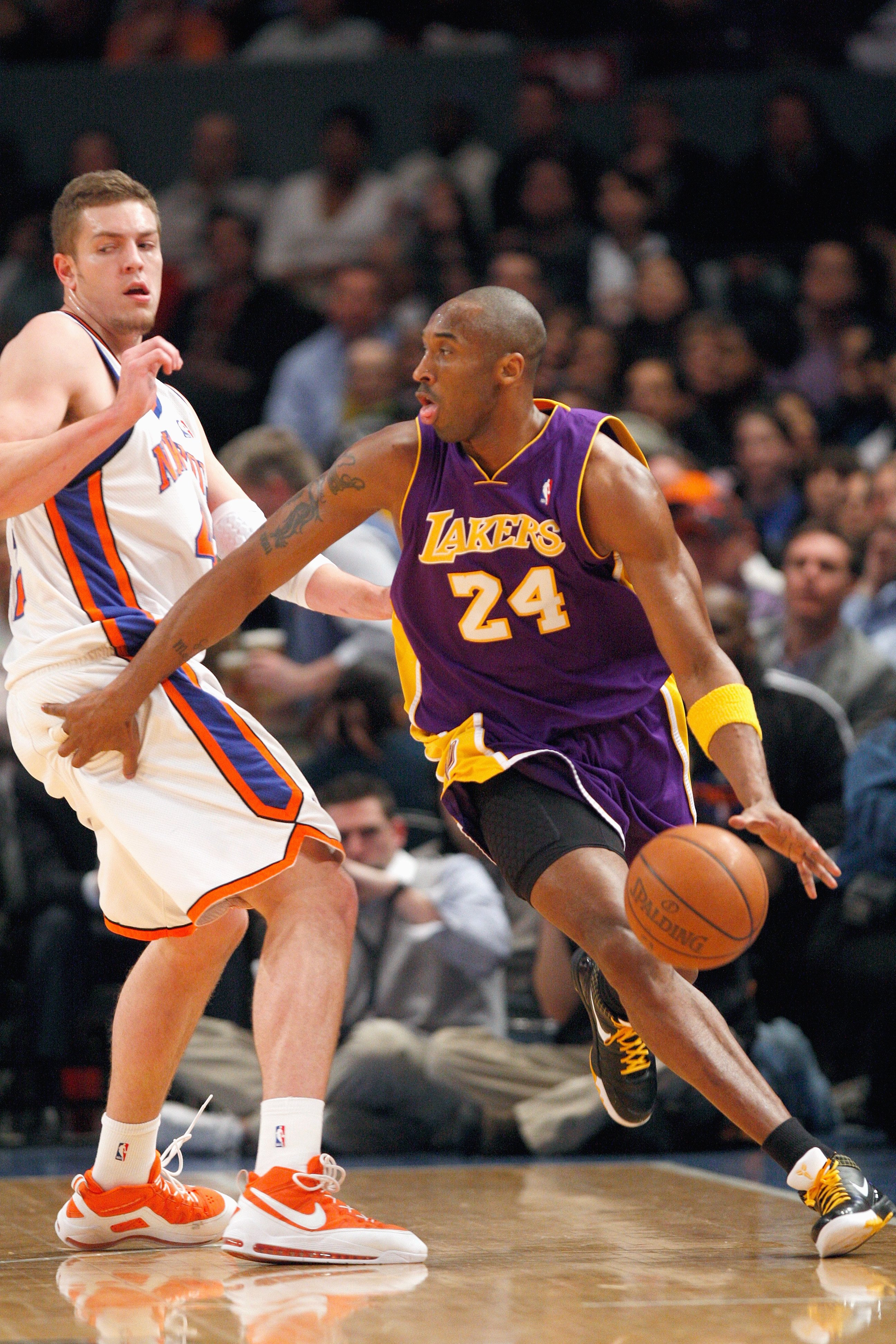 NEW YORK - FEBRUARY 2:  Kobe Bryant #24 of the Los Angeles Lakers drives the ball against David Lee #42 of the New York Knicks on February 2, 2009 at Madison Square Garden in New York City. NOTE TO USER: User expressly acknowledges and agrees that, by dow