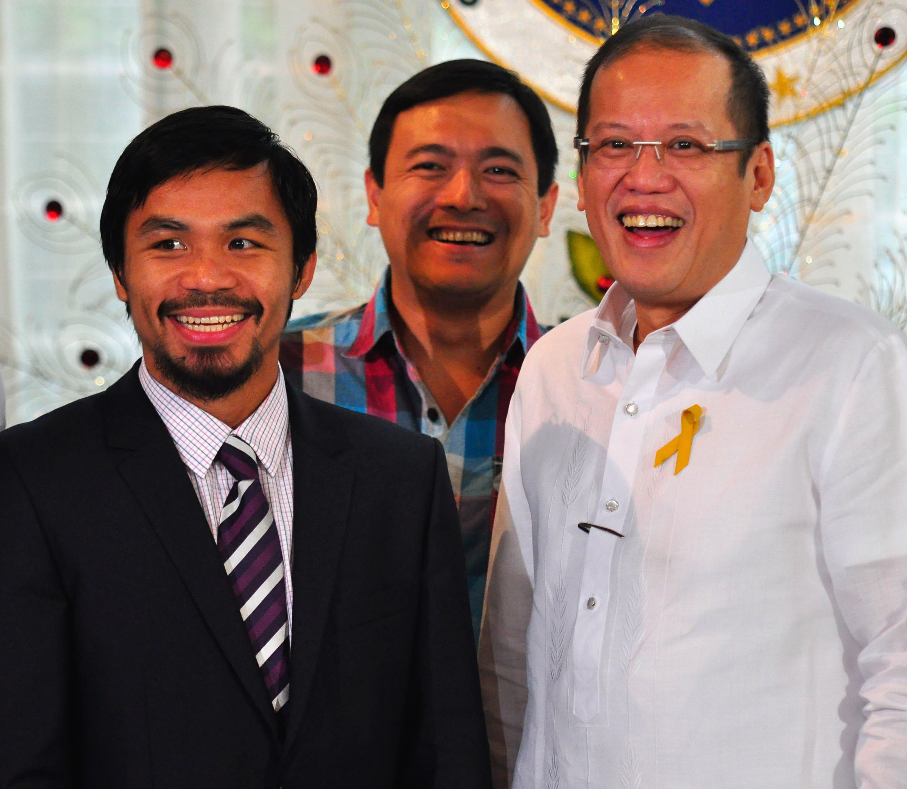 MANILA, PHILIPPINES - NOVEMBER 20:  Boxer and congressman, Manny Pacquiao and Philippine President Benigno Aquinoo III share a laugh at Malacanang Palace in Manila following his win of the WBC super welterweight crown against Mexican Antonio Margarito on