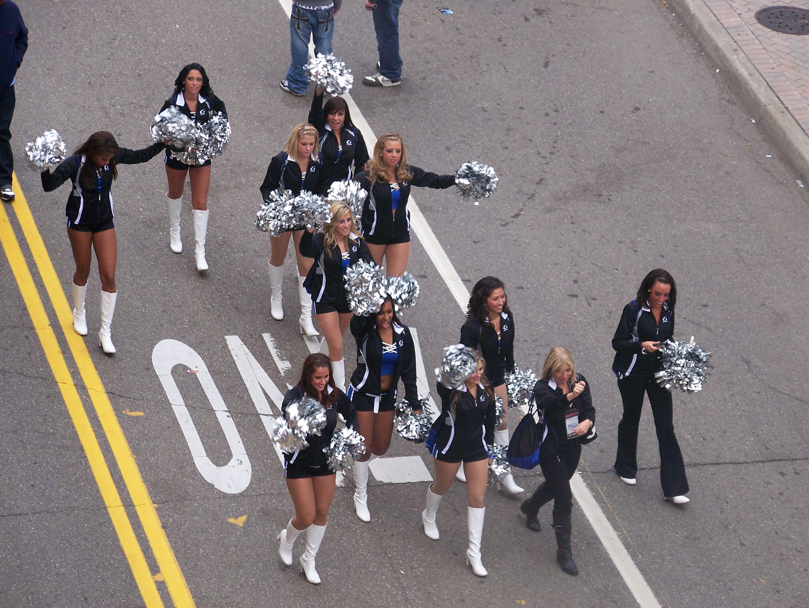 Detroit Pride Cheerleaders parade down Brush Street following the Lions win over the Redskins.  Lions fans hope for victory this Sunday in the season finale against the Minnesota Vikings.