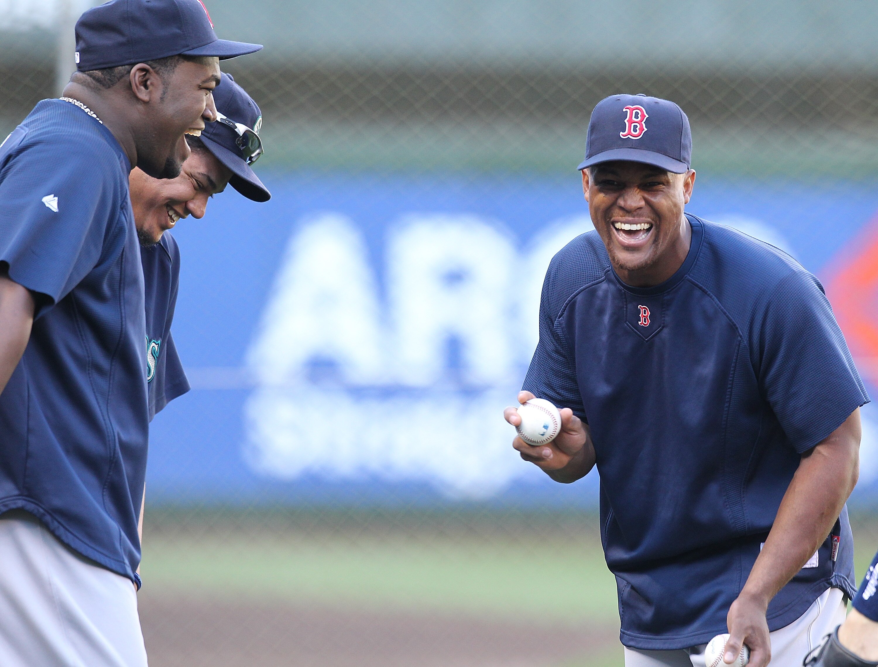 SEATTLE - SEPTEMBER 13:  Former Seattle Mariner Adrian Beltre #29 (R) of the Boston Red Sox shares a laugh with Mariners' pitcher Felix Hernandez #34 and Red Sox teammate David Ortiz #34 (far left) during batting practice prior to their game at Safeco Fie