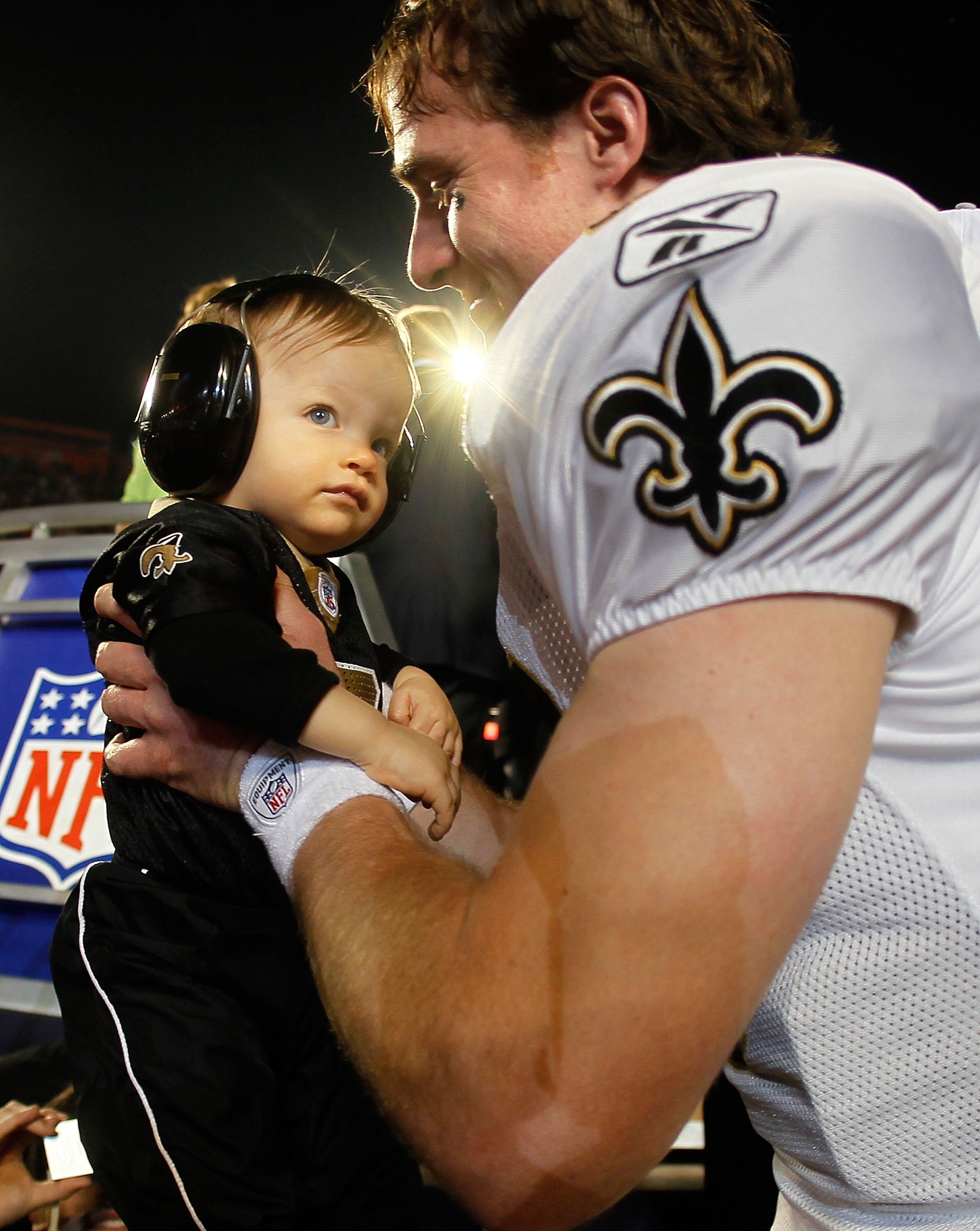 MIAMI GARDENS, FL - FEBRUARY 07:  Drew Brees #9 of the New Orleans Saints picks up his son Baylen Brees to celebrate after the Saints defeated the Indianapolis Colts during Super Bowl XLIV on February 7, 2010 at Sun Life Stadium in Miami Gardens, Florida.