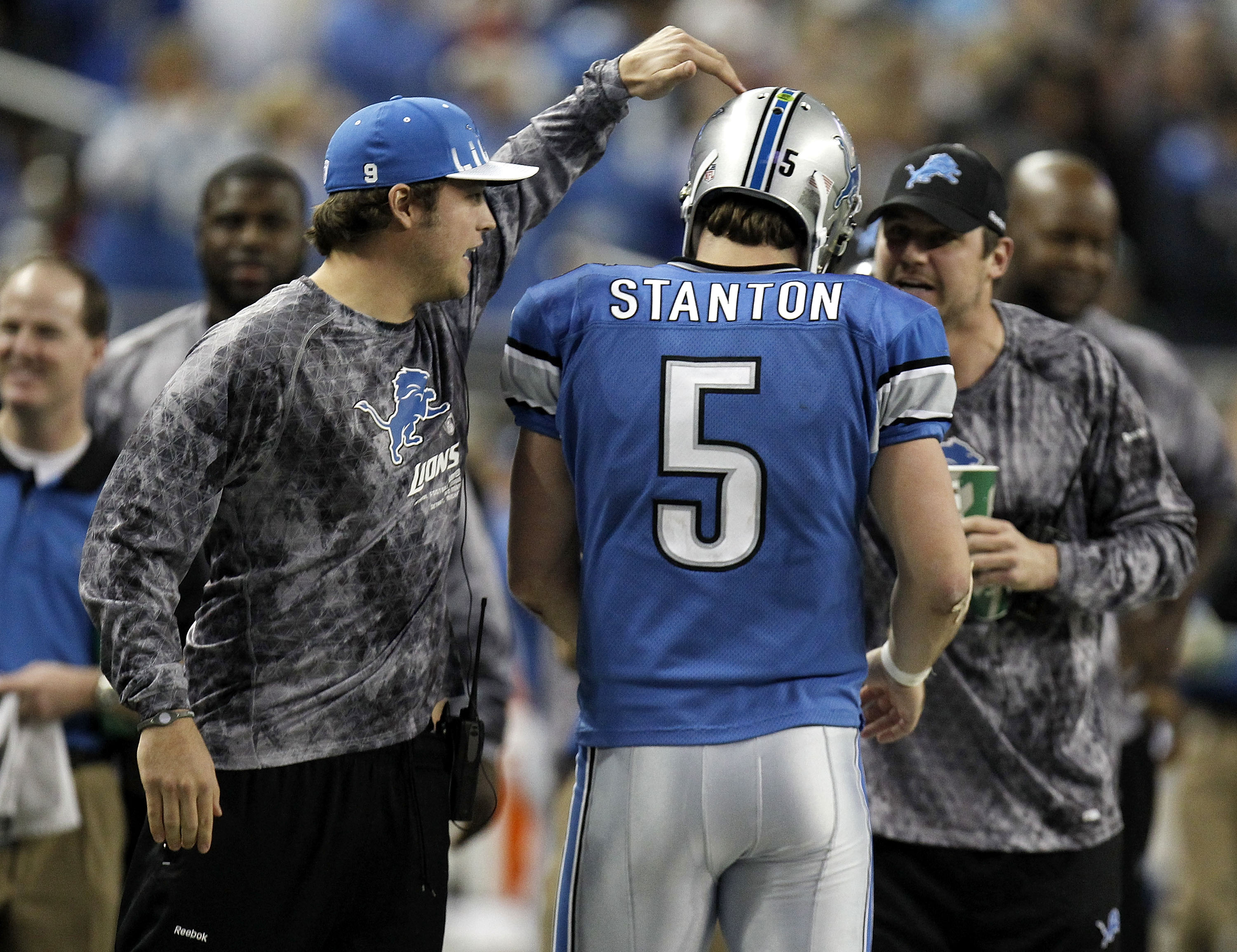 DETROIT, MI - DECEMBER 12:  Drew Stanton #5 of the Detroit Lions is congragulated by Matthew Stafford #9 and Shaun Hill #14 after a fourth quarter touchdown against the Green Bay Packers on December 12, 2010 at Ford Field in Detroit, Michigan. Detroit won