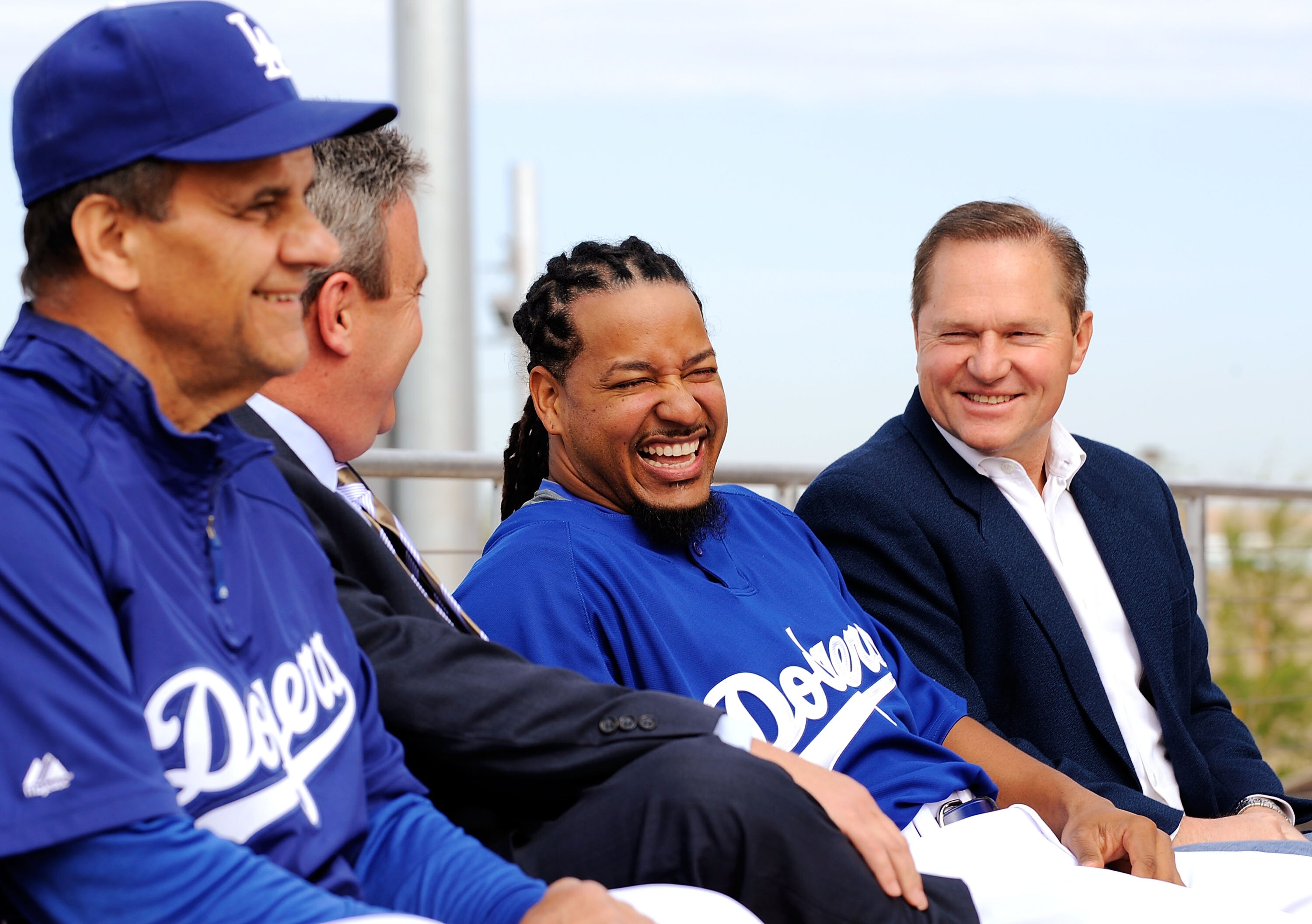 GLENDALE, AZ - MARCH 05:  Manny Ramirez#99, second right, smiles as his Agent Scott Boras (L) general manager Ned Colletti, second right, and manager Joe Torre look on during a news conference on March 5, 2009, at Camelback Ranch in Glendale, Arizona. Ram