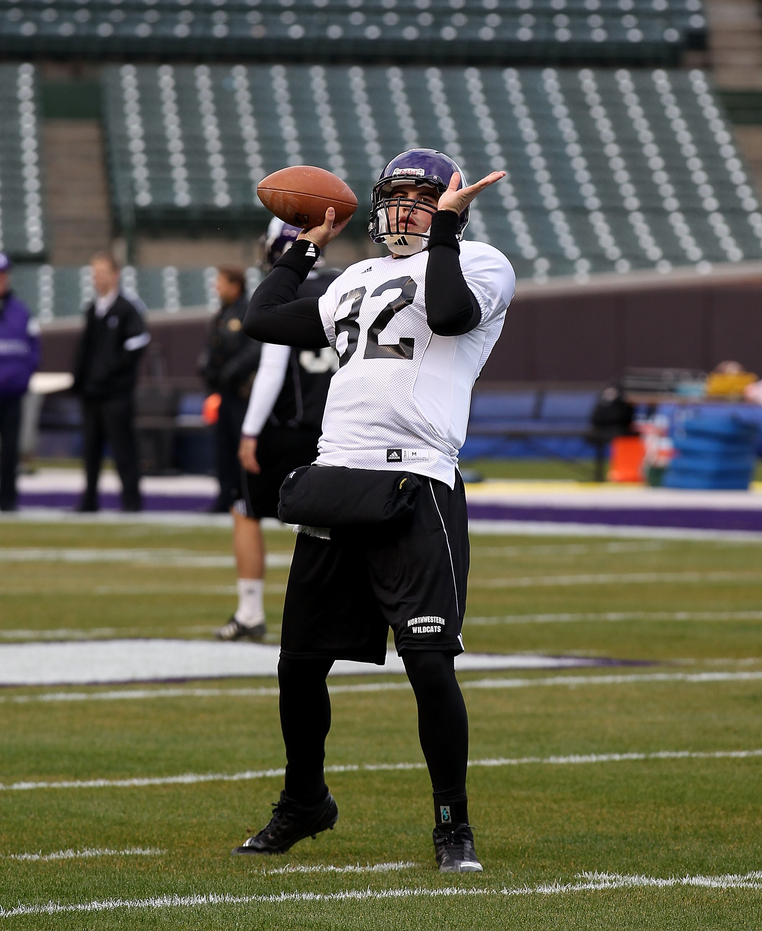 CHICAGO - NOVEMBER 18: Evan Watkins #82 of Northwestern Wildcats, who will start at quarterback, throws a pass during practice for a game against the Illinois Fighting Illini on Saturday November 20 at Wrigley Field on November 18, 2010 in Chicago, Illino