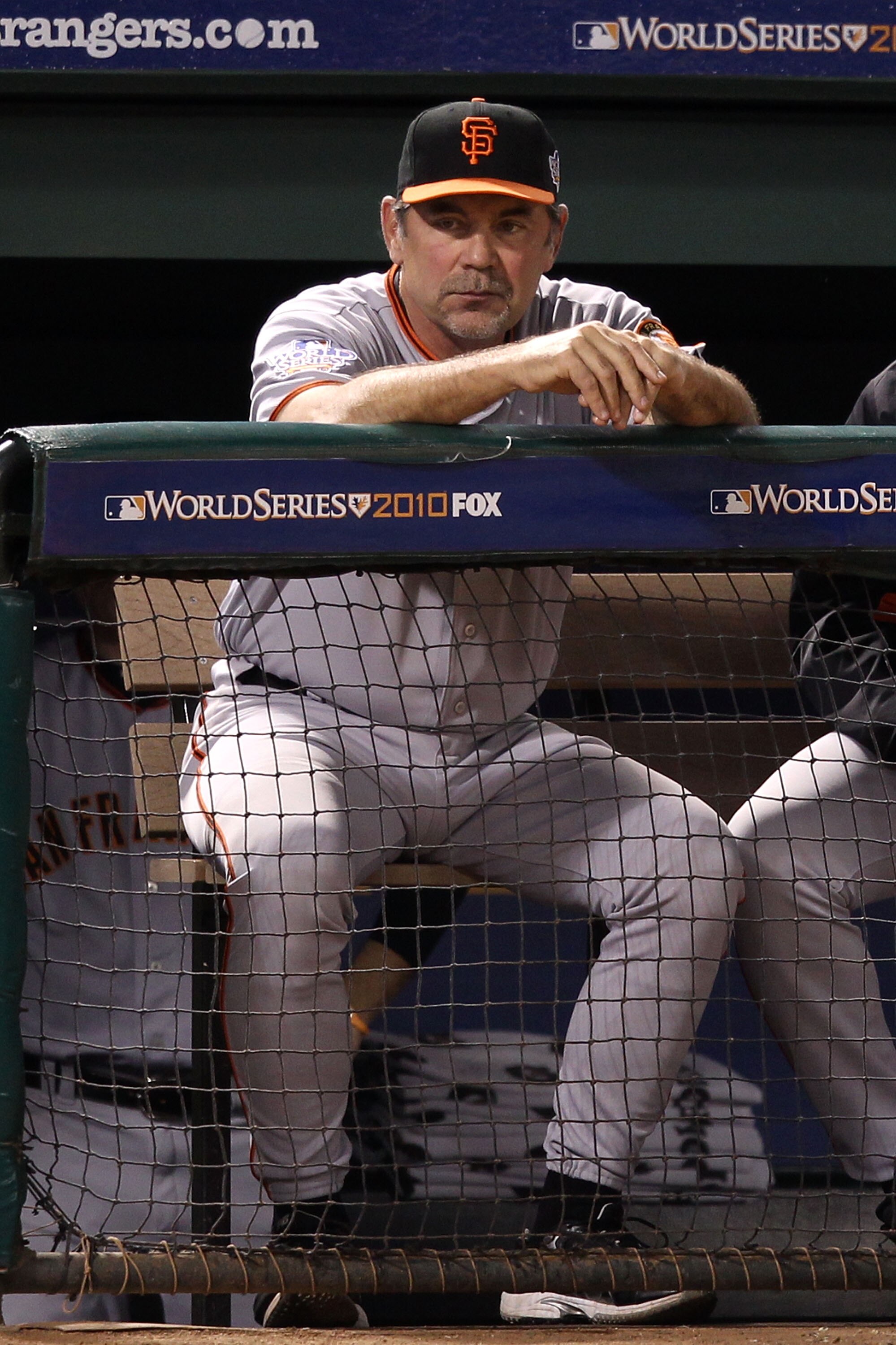 ARLINGTON, TX - OCTOBER 31:  Bruce Bochy of the San Francisco Giants looks on from the dugout against the Texas Rangers in Game Four of the 2010 MLB World Series at Rangers Ballpark in Arlington on October 31, 2010 in Arlington, Texas.  (Photo by Christia
