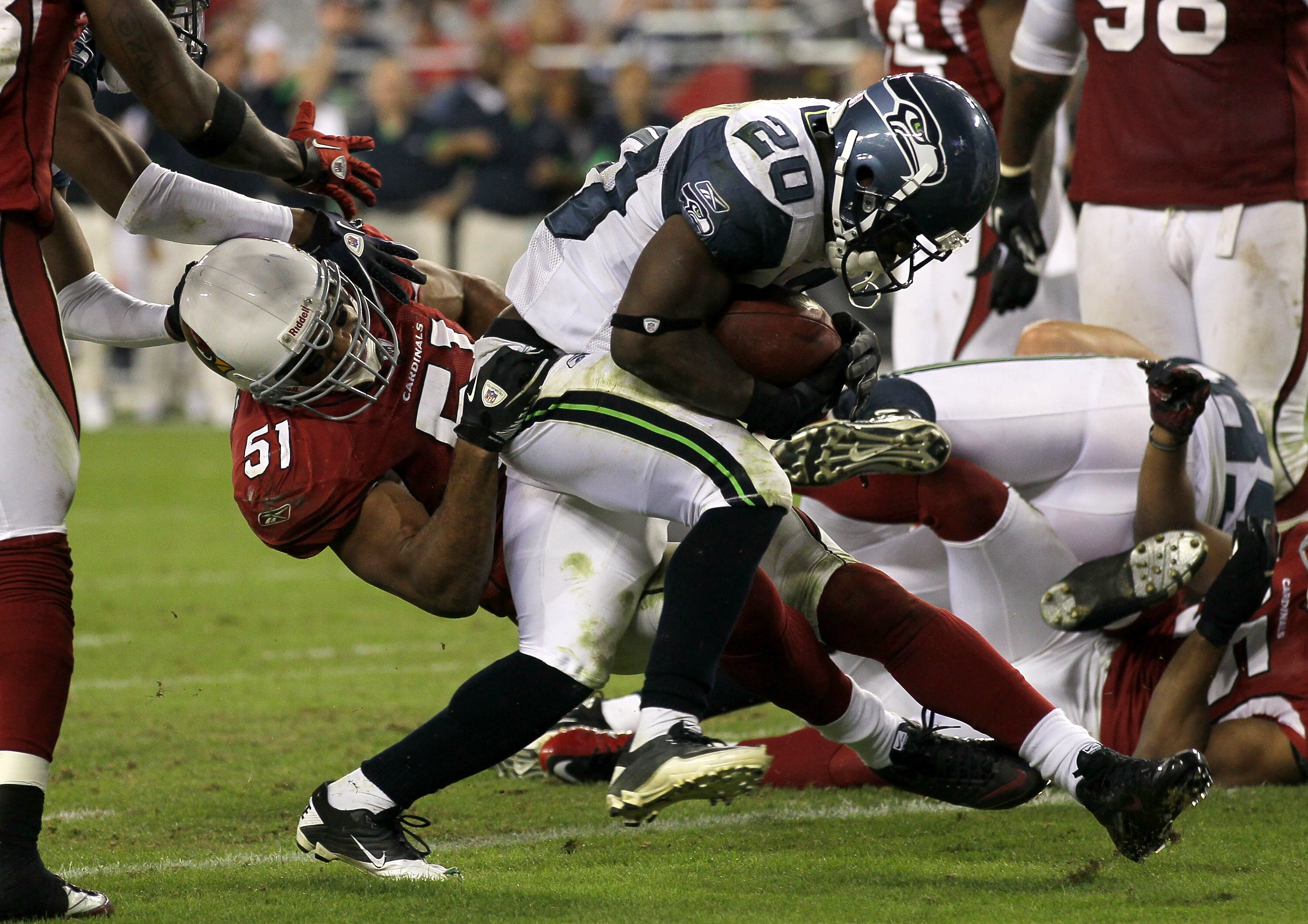 GLENDALE, AZ - NOVEMBER 14:  Running back Justin Forsett #20 of the Seattle Seahawks breaks the tackle of linebacker Paris Lenon #51 of the Arizona Cardinals to score on a four yard touchdown carry in the fourth quarter at University of Phoenix Stadium on