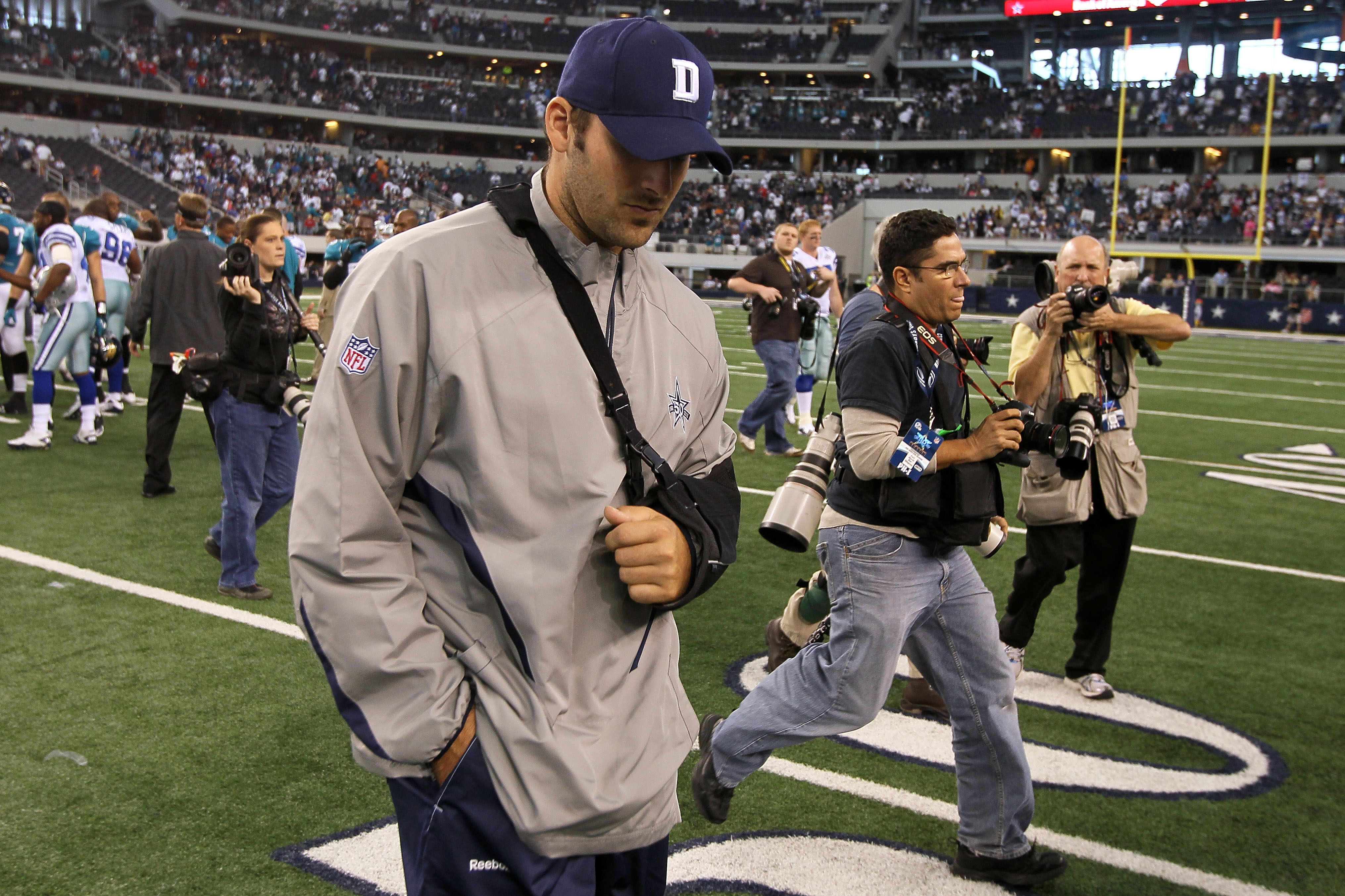 ARLINGTON, TX - OCTOBER 31:  Injured quarterback Tony Romo of the Dallas Cowboys walks off the field with his head down after the Cowboys lost 35-17 against the Jacksonville Jaguars at Cowboys Stadium on October 31, 2010 in Arlington, Texas.  (Photo by St