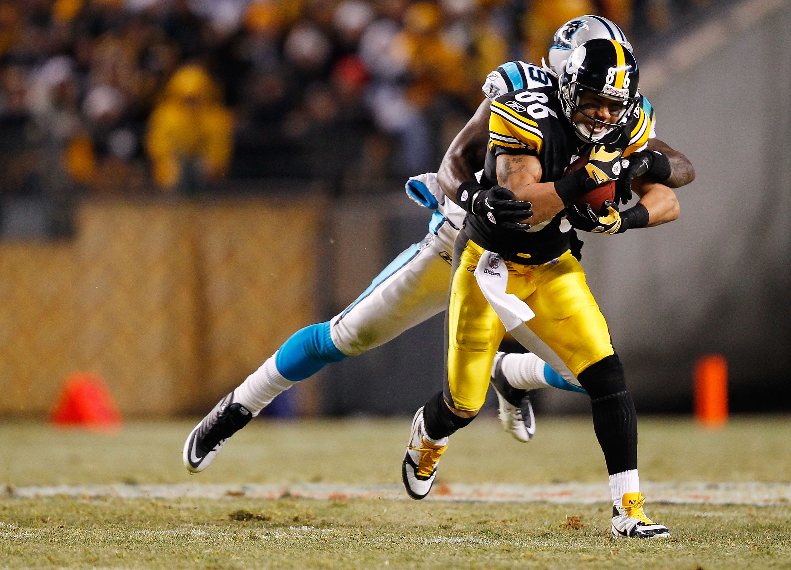 PITTSBURGH - DECEMBER 23:  Hines Ward #86 of the Pittsburgh Steelers catches a pass in front of a Carolina Panthers defender during the game on December 23, 2010 at Heinz Field in Pittsburgh, Pennsylvania.  (Photo by Jared Wickerham/Getty Images)