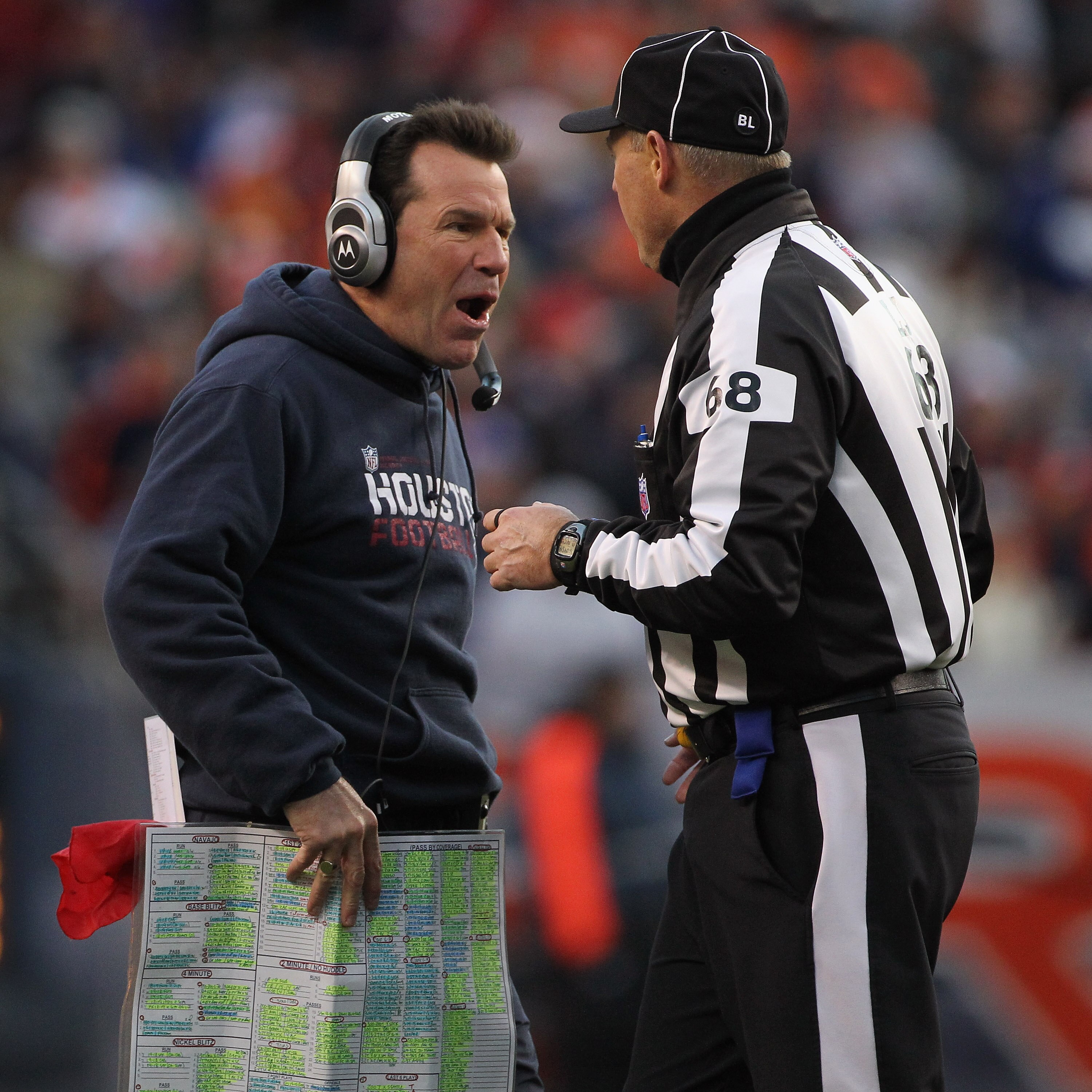 DENVER - DECEMBER 26:  Head coach Gary Kubiak of the Houston Texas questions a call with Line Judge Tom Stephan as he faces the Denver Broncos at INVESCO Field at Mile High on December 26, 2010 in Denver, Colorado. The Broncos defeated the Texans 24-23.