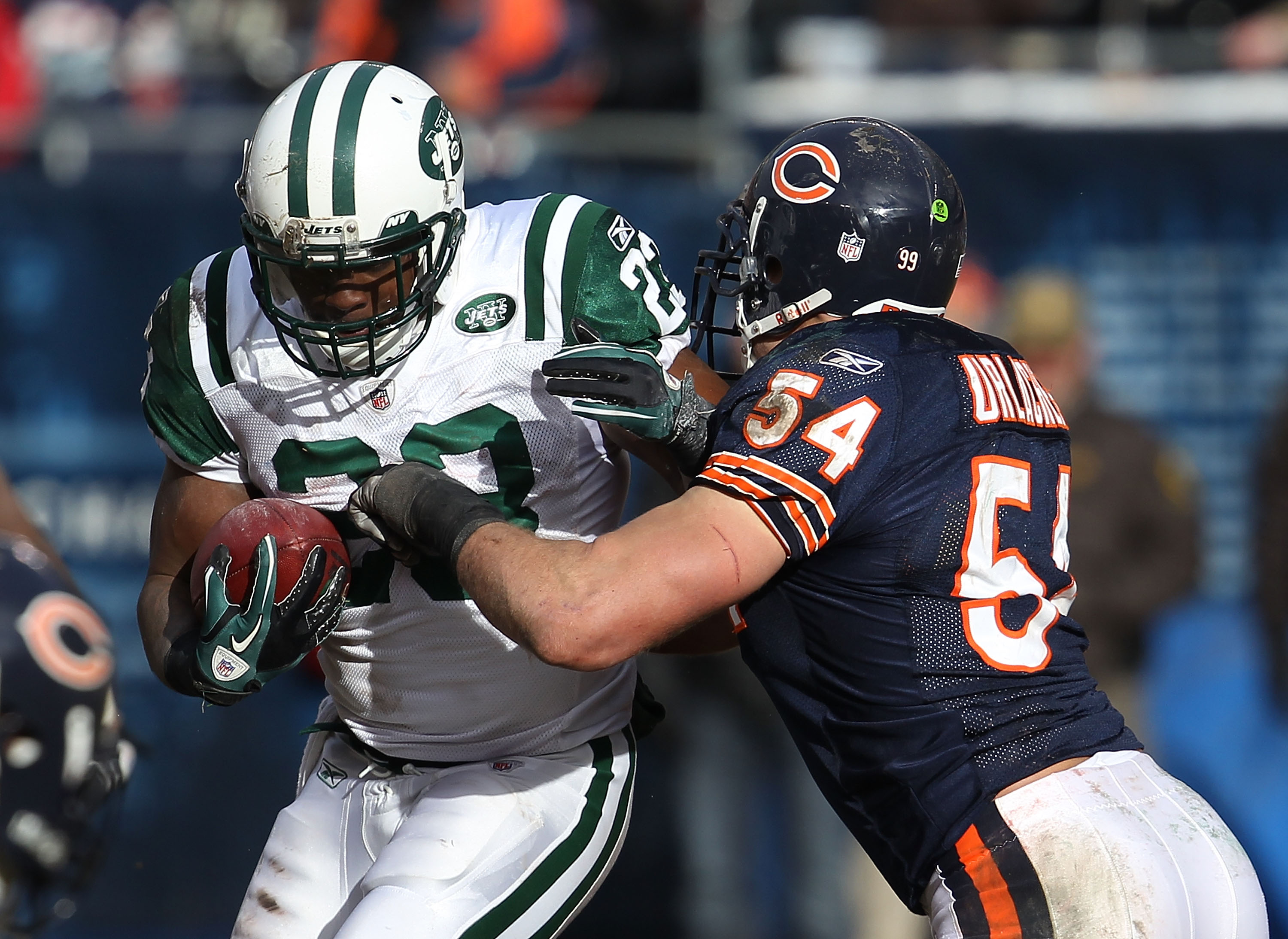 CHICAGO, IL - DECEMBER 26: Brian Urlacher #54 of the Chicago Bears brings down Shonn Greene #23 the New York Jets at Soldier Field on December 26, 2010 in Chicago, Illinois. The Bears defeated the Jets 38-34. (Photo by Jonathan Daniel/Getty Images)