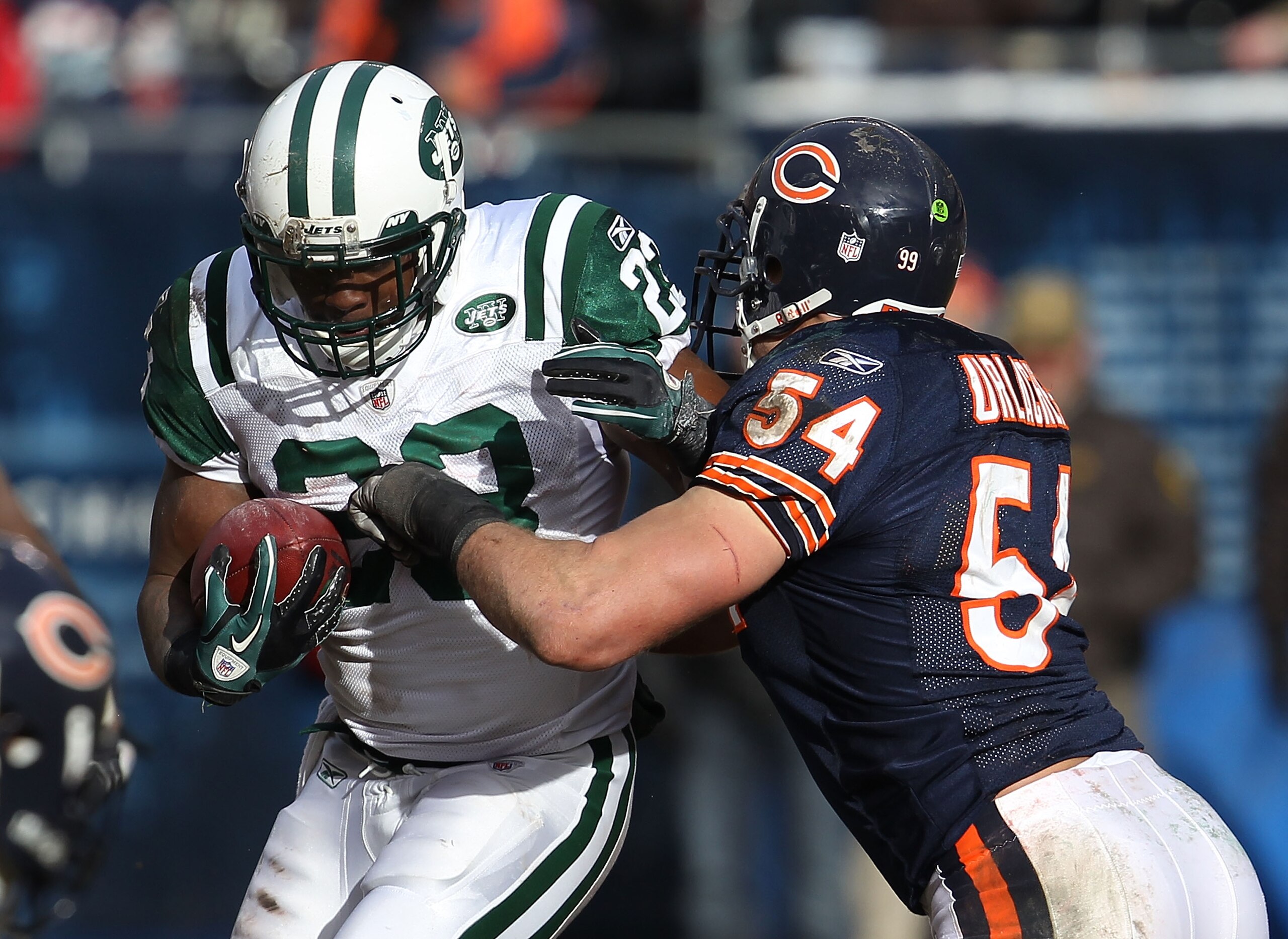 CHICAGO, IL - DECEMBER 26: Brian Urlacher #54 of the Chicago Bears brings down Shonn Greene #23 the New York Jets at Soldier Field on December 26, 2010 in Chicago, Illinois. The Bears defeated the Jets 38-34. (Photo by Jonathan Daniel/Getty Images)