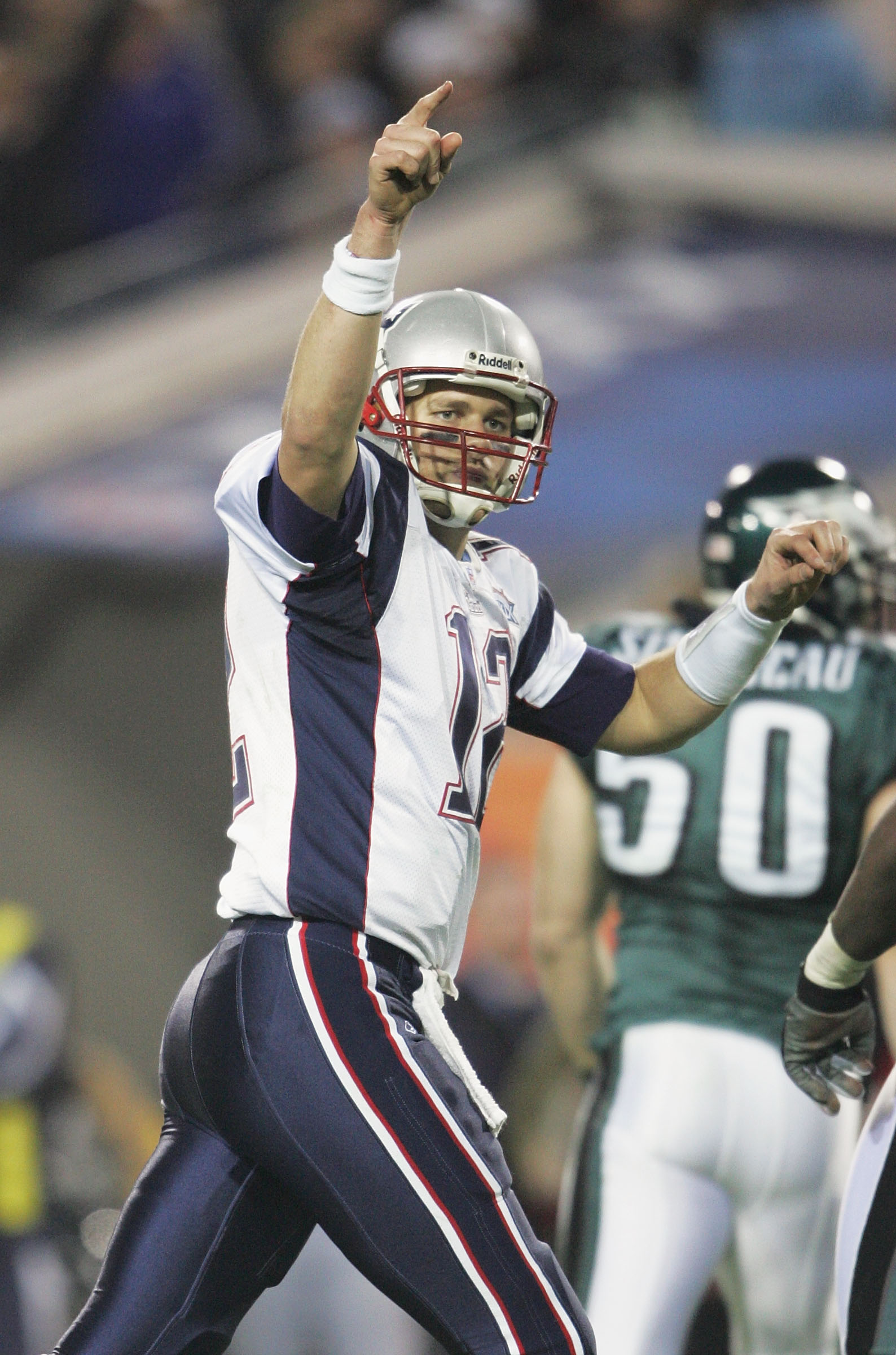 JACKSONVILLE, FL - FEBRUARY 6:  Quarterback Tom Brady #12 of the New England Patriots celebrates after running back Corey Dillon #28 scored a touchdown against the Philadelphia Eagles in Super Bowl XXXIX at Alltel Stadium on February 6, 2005 in Jacksonvil