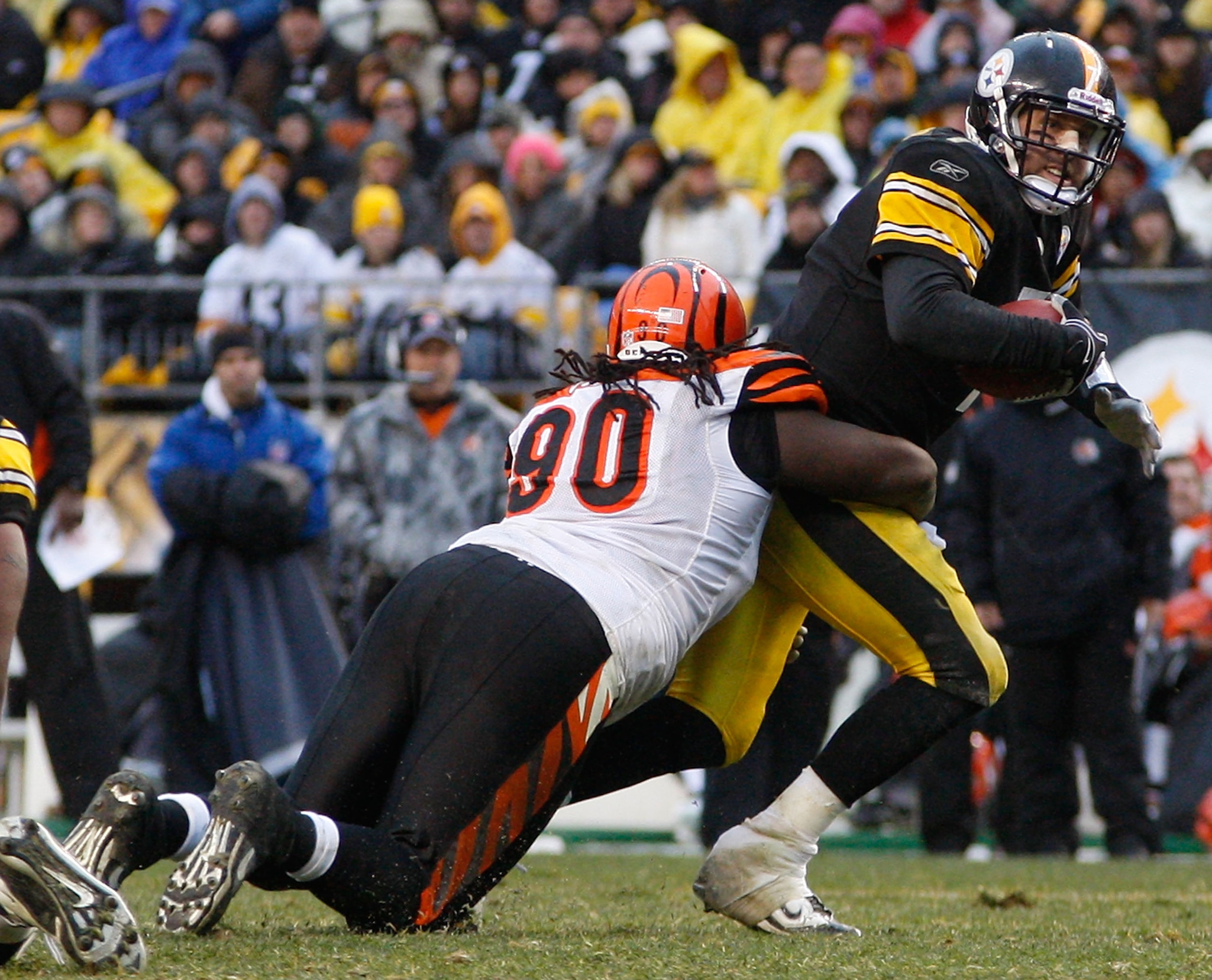 PITTSBURGH - DECEMBER 12:  Ben Roethlisberger #7 of the Pittsburgh Steelers is sacked by Pat Sims #90 of the Cincinnati Bengals during the game on December 12, 2010 at Heinz Field in Pittsburgh, Pennsylvania.  (Photo by Jared Wickerham/Getty Images)