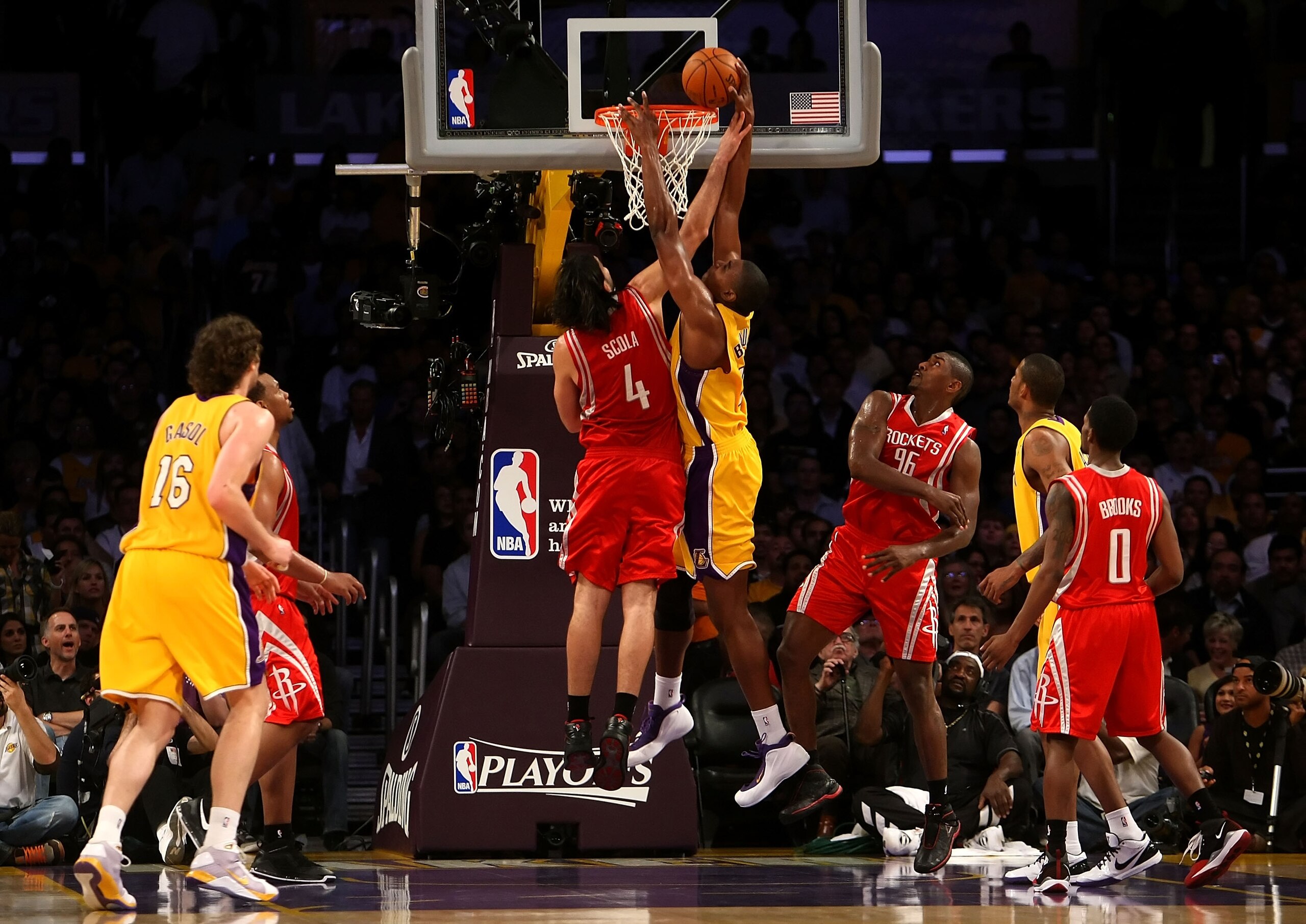 LOS ANGELES, CA - MAY 12:  Andrew Bynum #17 of the Los Angeles Lakers goes up for a dunk over Luis Scola #4 of the Houston Rockets in the third quarter of Game Five of the Western Conference Semifinals during the 2009 NBA Playoffs at Staples Center on May