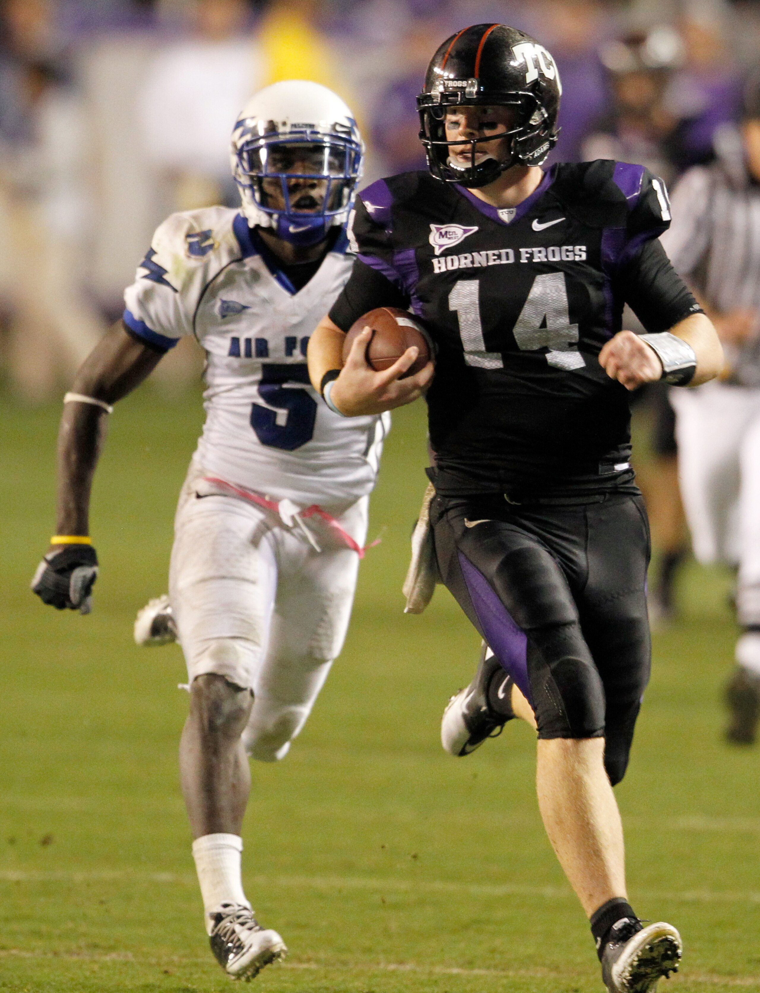FORT WORTH, TX - OCTOBER 23: Quarterback Andy Dalton #14 of the TCU Horned Frogs carries the ball against defensive back Anthony Wright Jr. #5 of the Air Force Falcons at Amon G. Carter Stadium on October 23, 2010 in Fort Worth, Texas. TCU beat Air Forc FORT WORTH, TX - OCTOBER 23: Quarterback Andy Dalton #14 of the TCU Horned Frogs carries the ball against defensive back Anthony Wright Jr. #5 of the Air Force Falcons at Amon G. Carter Stadium on October 23, 2010 in Fort Worth, Texas. TCU beat Air Forc