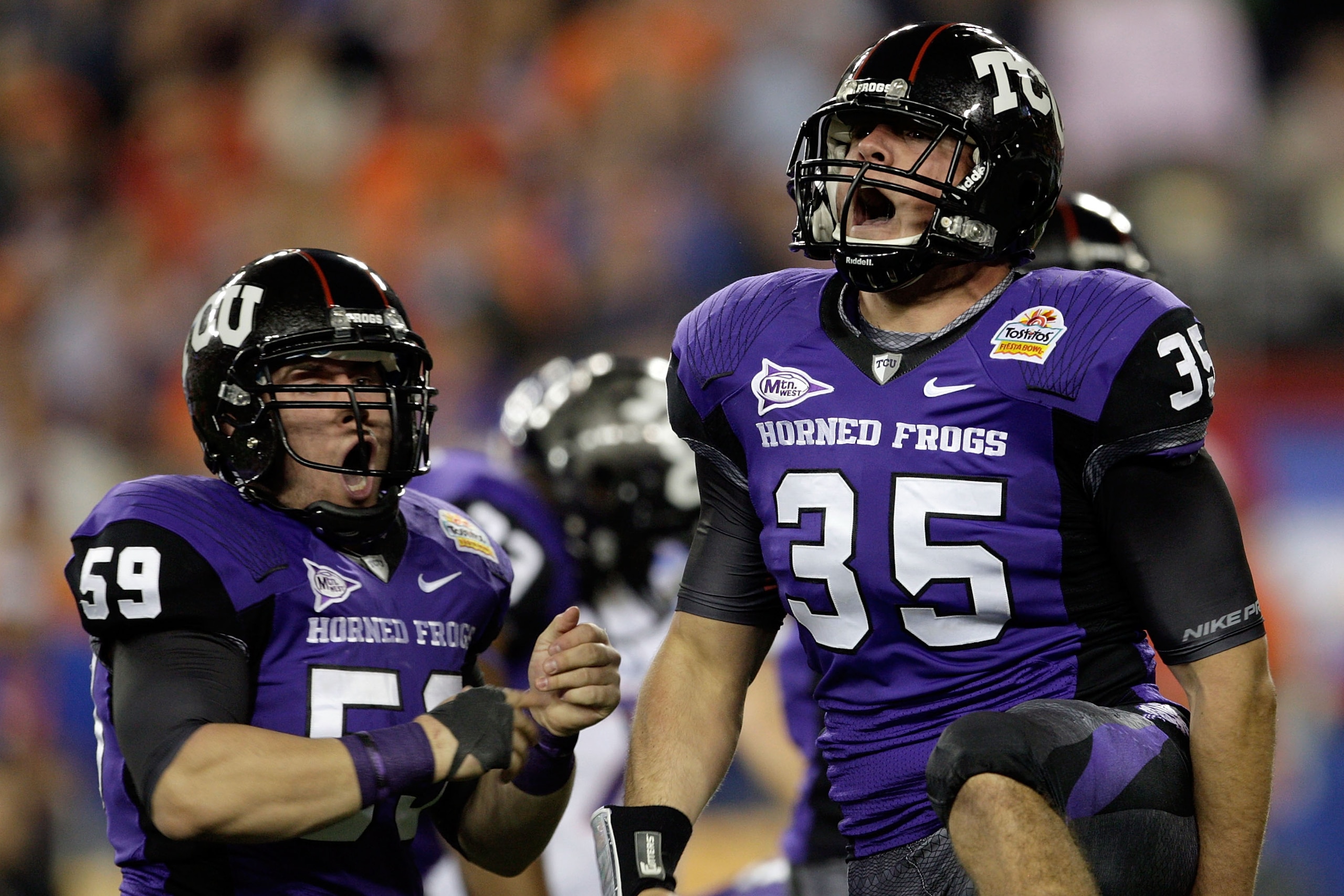 GLENDALE, AZ - JANUARY 04: (R-L) Tanner Brock #35 and Logan Sligar #59 of the TCU Horned Frogs react after making a tackle in the first half against the Boise State Broncos during the Tostitos Fiesta Bowl at the Universtity of Phoenix Stadium on January GLENDALE, AZ - JANUARY 04: (R-L) Tanner Brock #35 and Logan Sligar #59 of the TCU Horned Frogs react after making a tackle in the first half against the Boise State Broncos during the Tostitos Fiesta Bowl at the Universtity of Phoenix Stadium on January