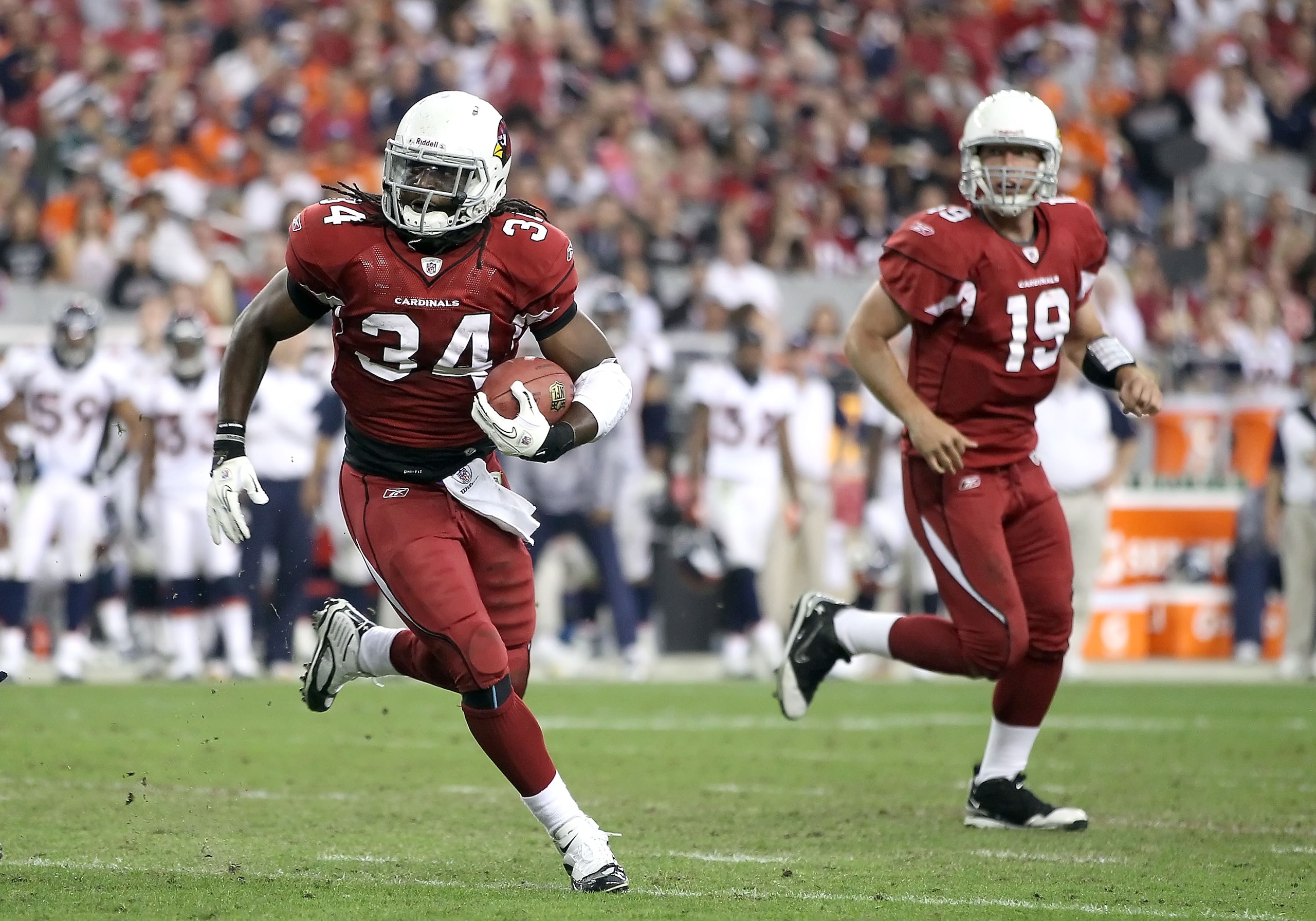 GLENDALE, AZ - DECEMBER 12:  Runningback Tim Hightower #34 of the Arizona Cardinals rushes the football against the Denver Broncos during the NFL game at the University of Phoenix Stadium on December 12, 2010 in Glendale, Arizona.  (Photo by Christian Pet