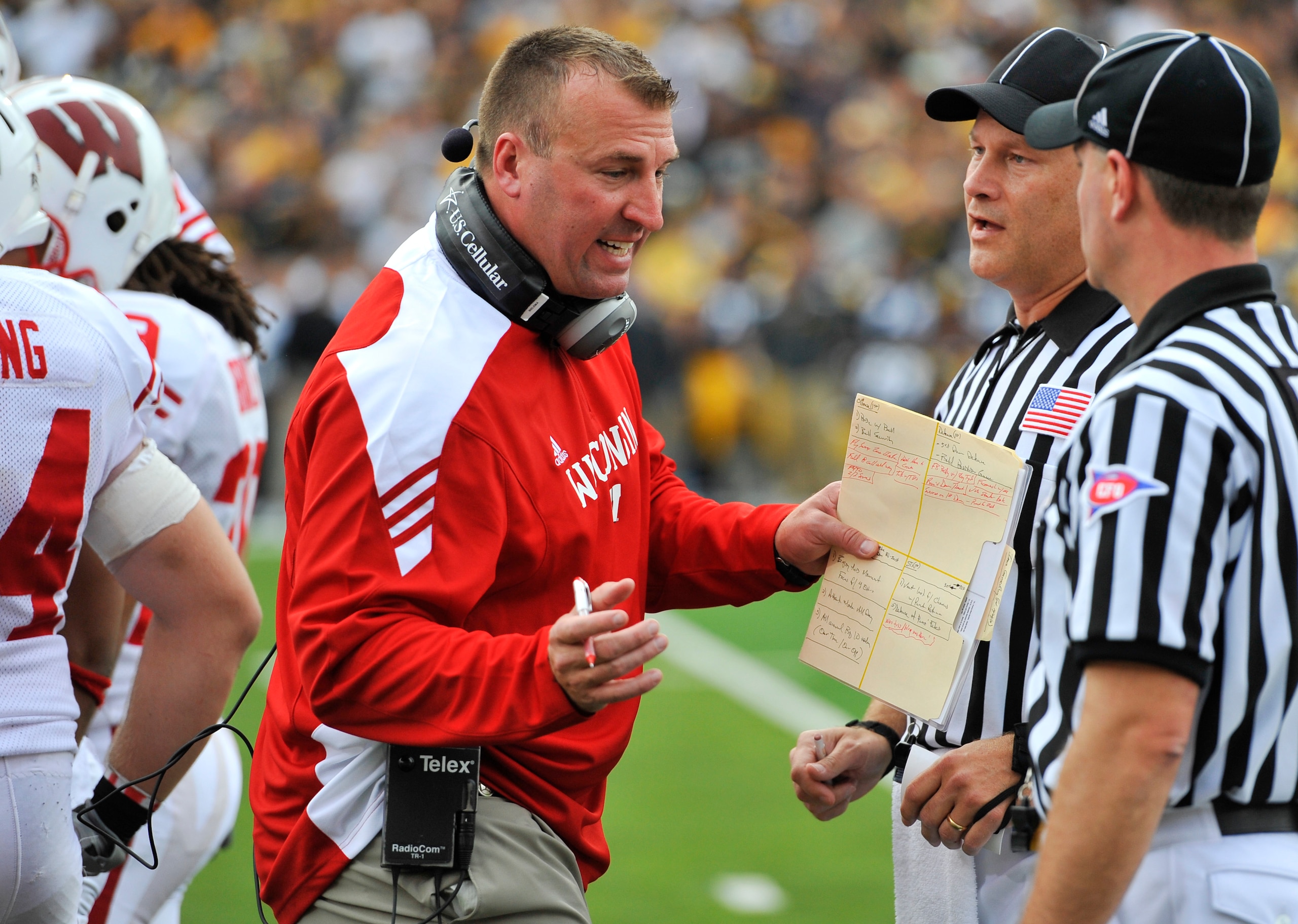 IOWA CITY, IA - OCTOBER 23- Head coach Bret Bielema of the Wisconsin Badgers debates a call with officials during the first half of play agains the University of Iowa Hawkeyes at Kinnick Stadium on October 23, 2010 in Iowa City, Iowa. Wisconsin won 31-30 IOWA CITY, IA - OCTOBER 23- Head coach Bret Bielema of the Wisconsin Badgers debates a call with officials during the first half of play agains the University of Iowa Hawkeyes at Kinnick Stadium on October 23, 2010 in Iowa City, Iowa. Wisconsin won 31-30