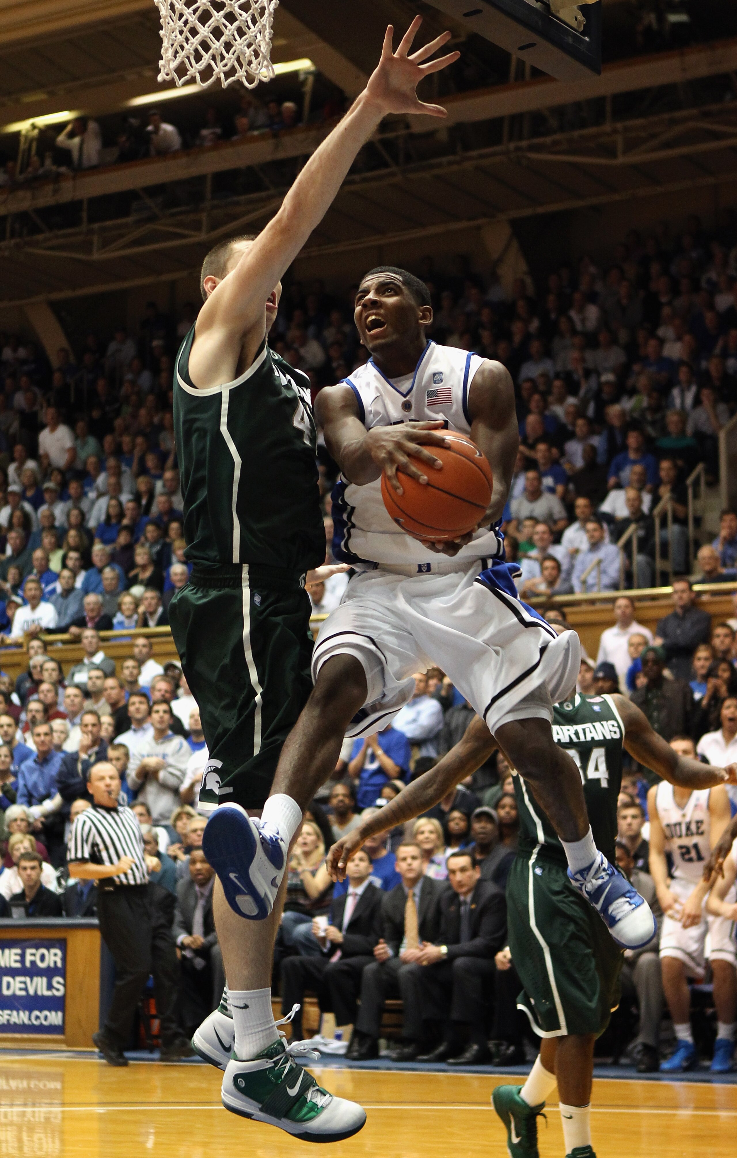 DURHAM, NC - DECEMBER 01:  Kyrie Irving #1 of the Duke Blue Devils drives to the basket during their game against Garrick Sherman #41 of the Michigan State Spartans at Cameron Indoor Stadium on December 1, 2010 in Durham, North Carolina.  (Photo by Street