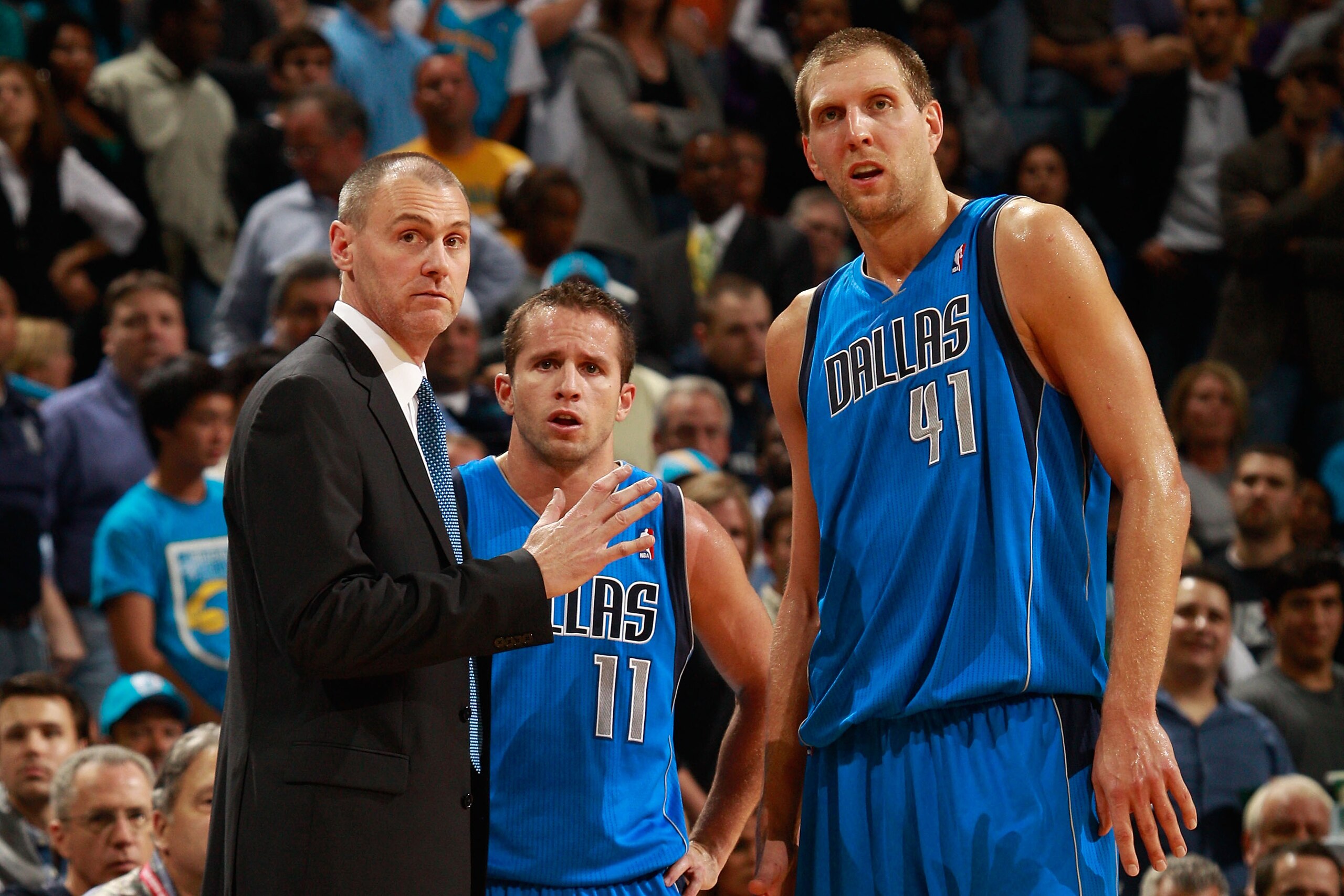 NEW ORLEANS - NOVEMBER 17:  Head coach Rick Carlisle talks with Jose Barea #11 and Dirk Nowitzki #41 of the Dallas Mavericks during a timeout against the New Orleans Hornets at the New Orleans Arena on November 17, 2010 in New Orleans, Louisiana.  The Hor