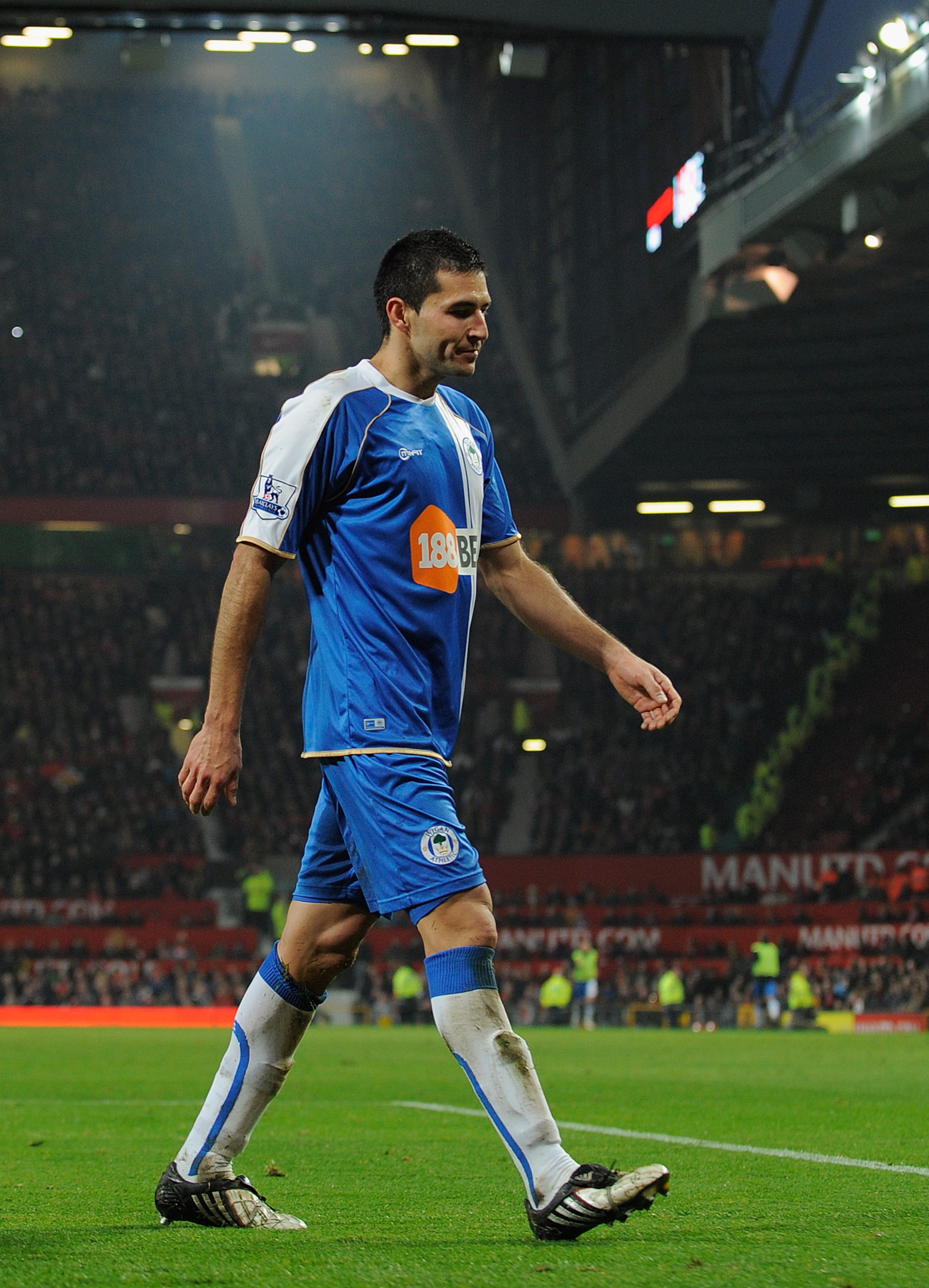 MANCHESTER, ENGLAND - NOVEMBER 20:  Antolin Alcaraz of Wigan walks of the pitch after getting a red card during the Barclays Premier League match between Manchester United and Wigan Athletic at Old Trafford on November 20, 2010 in Manchester, England.  (P