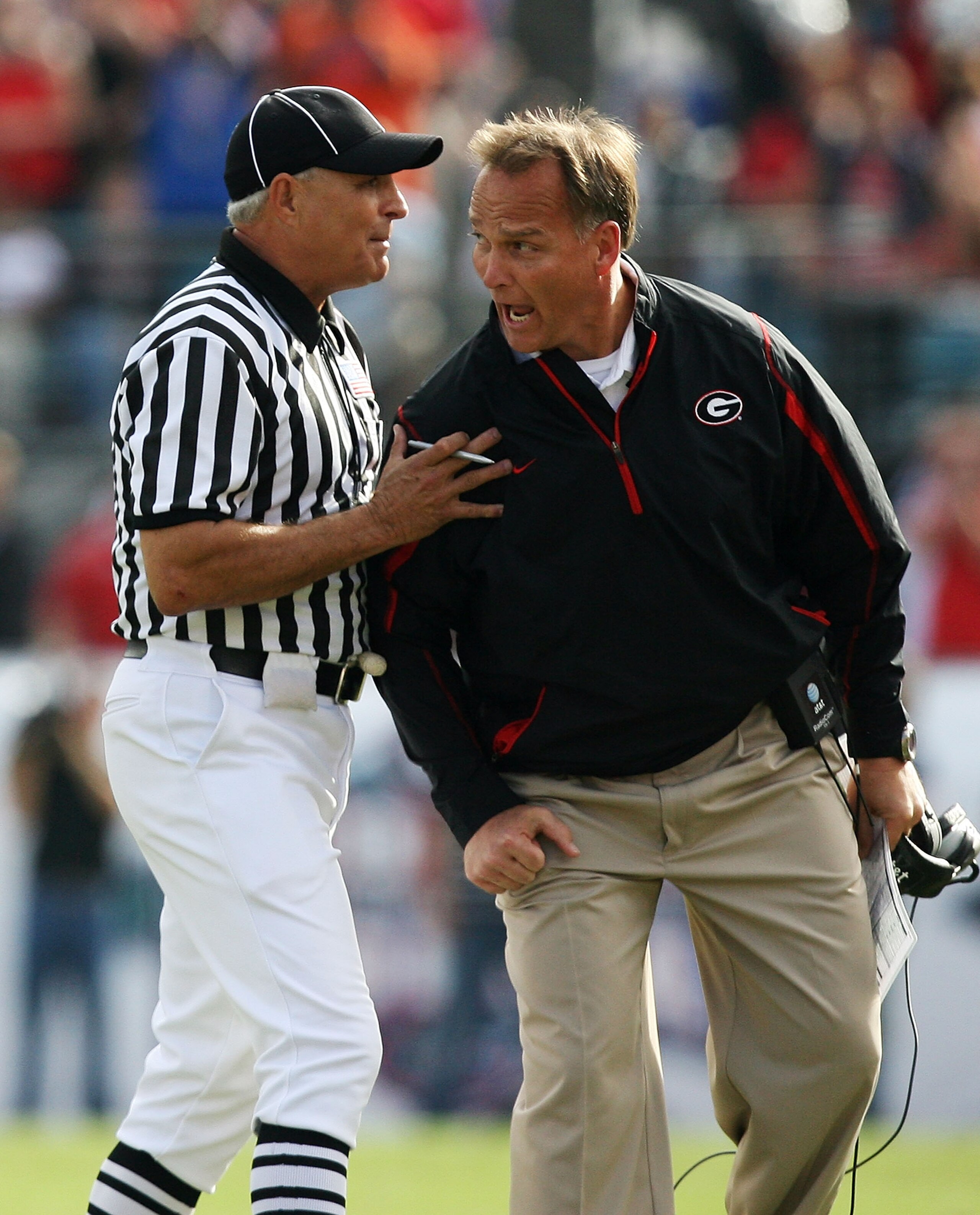 JACKSONVILLE, FL - NOVEMBER 01:  Linesman Lane Thomas holds back head coach Mark Richt of the Georgia Bulldogs after a call went against the Bulldogs while taking on the Florida Gators at Jacksonville Municipal Stadium on November 1, 2008 in Jacksonville,