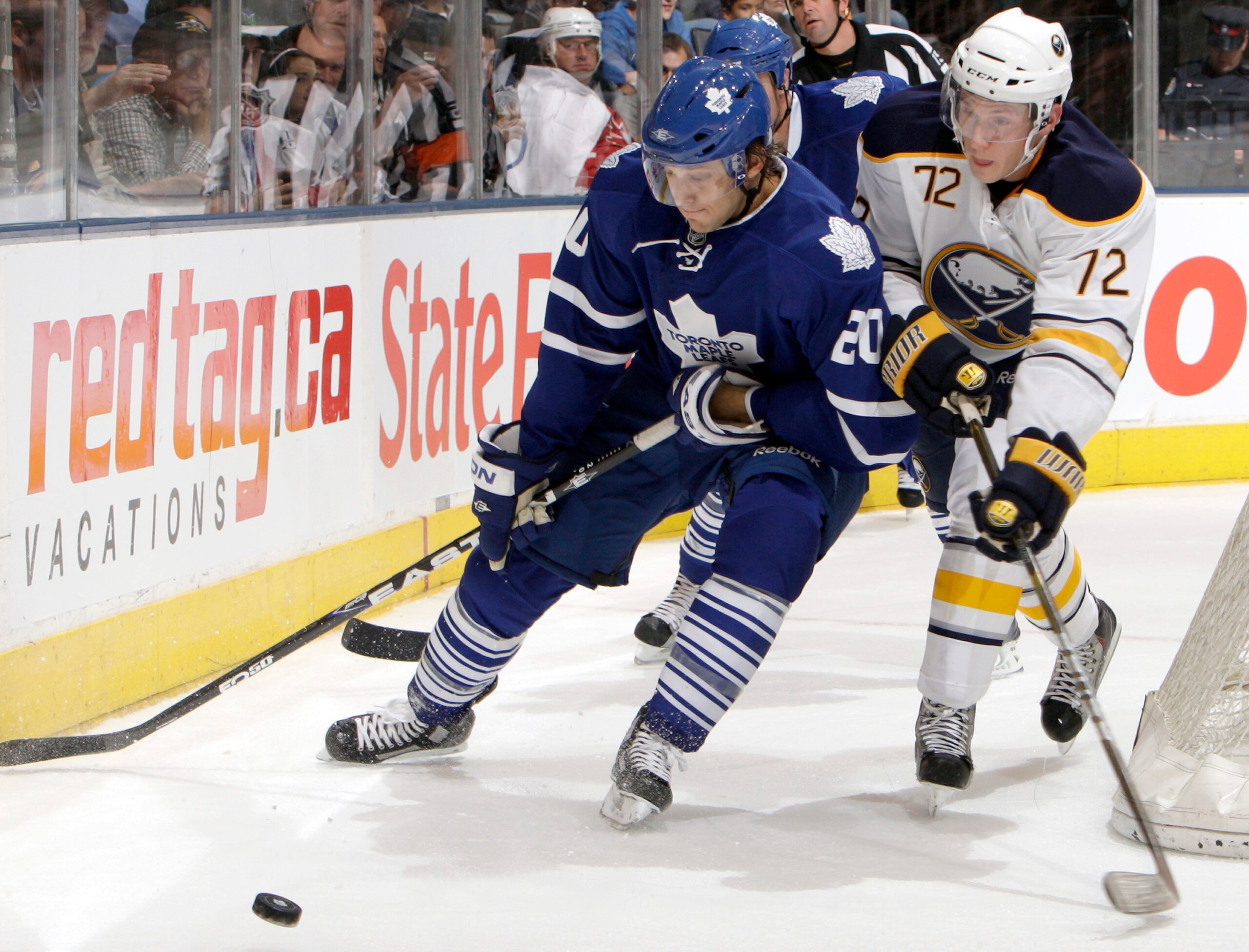 TORONTO - SEPTEMBER 27: Christian Hanson #20 of the Toronto Maple Leafs gets away from Luke Adam #72 of the Buffalo Sabres during a preseason NHL game at the Air Canada Centre September 27, 2010 in Toronto, Ontario, Canada. (Photo by Abelimages/Getty Imag TORONTO - SEPTEMBER 27: Christian Hanson #20 of the Toronto Maple Leafs gets away from Luke Adam #72 of the Buffalo Sabres during a preseason NHL game at the Air Canada Centre September 27, 2010 in Toronto, Ontario, Canada. (Photo by Abelimages/Getty Imag