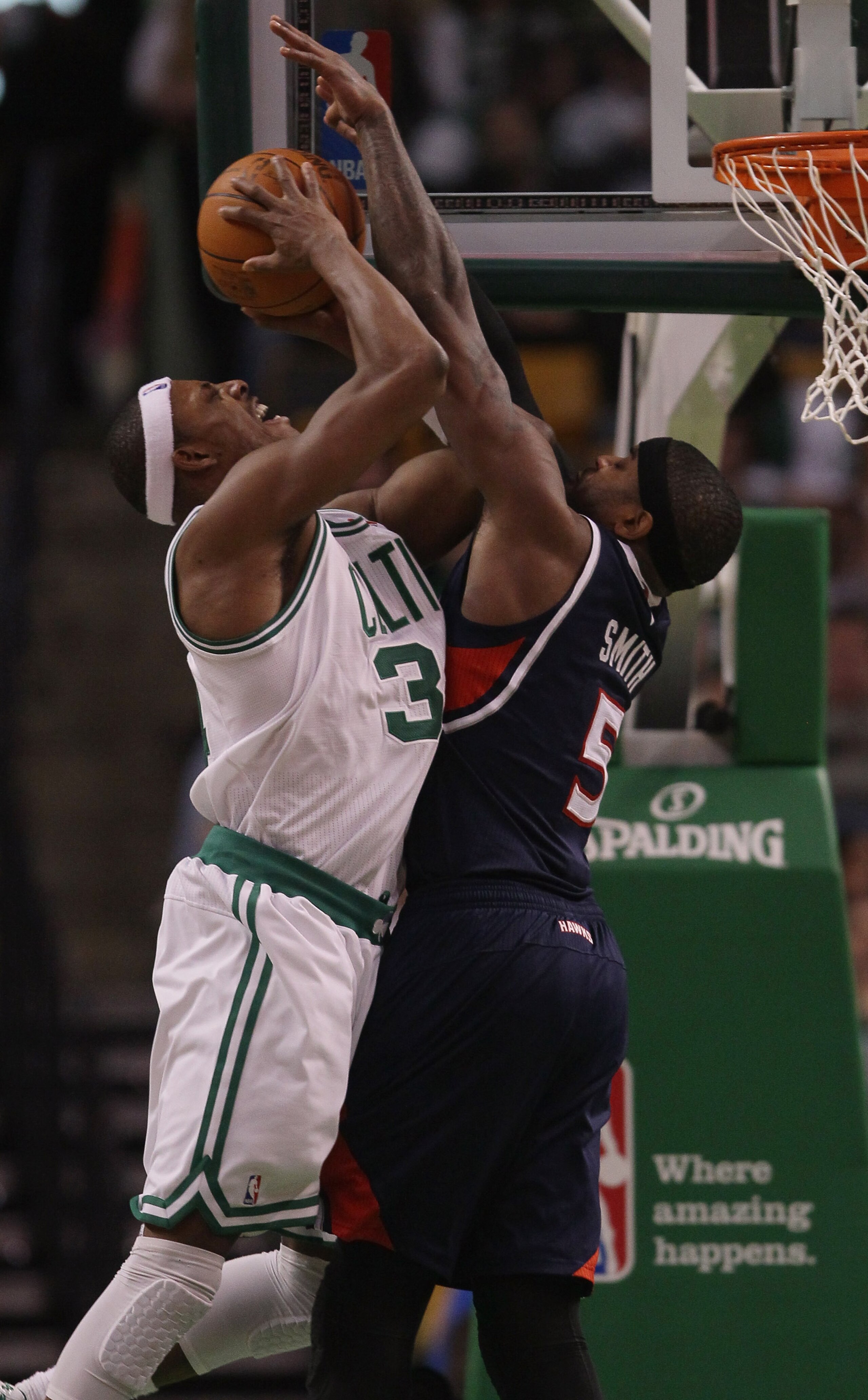 BOSTON, MA - DECEMBER 16:  Paul Pierce #34 of the Boston Celtics is fouled by Josh Smith #5 of the Atlanta Hawks on December 16, 2010 at the TD Garden in Boston, Massachusetts. The Celtics defeated the Hawks 102-90. NOTE TO USER: User expressly acknowledg