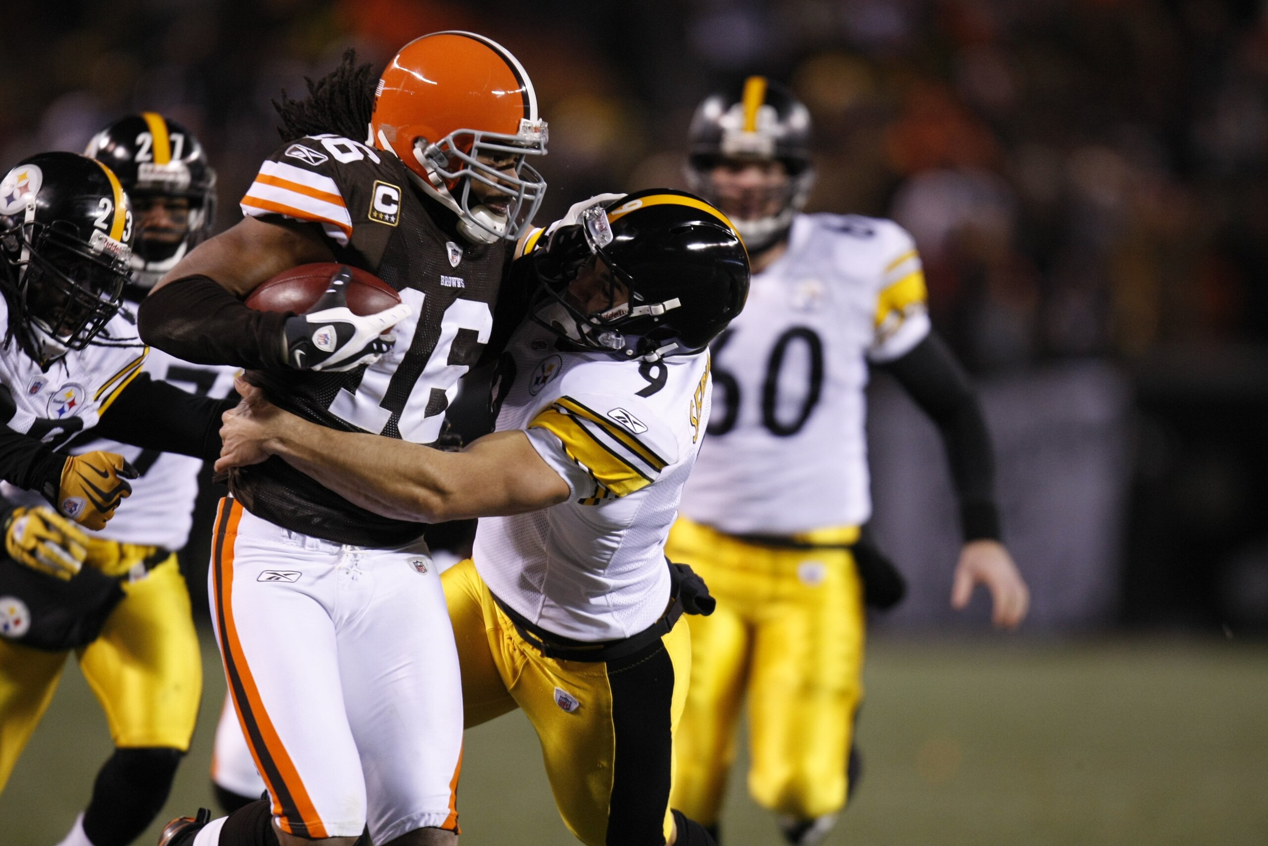 CLEVELAND - DECEMBER 10:  Joshua Cribbs #16 of the Cleveland Browns runs with the ball against Daniel Sepulveda #9 of the Pittsburgh Steelers on December 10, 2009 at Cleveland Browns Stadium in Cleveland, Ohio. Cleveland won the game 13-6.  (Photo by Greg