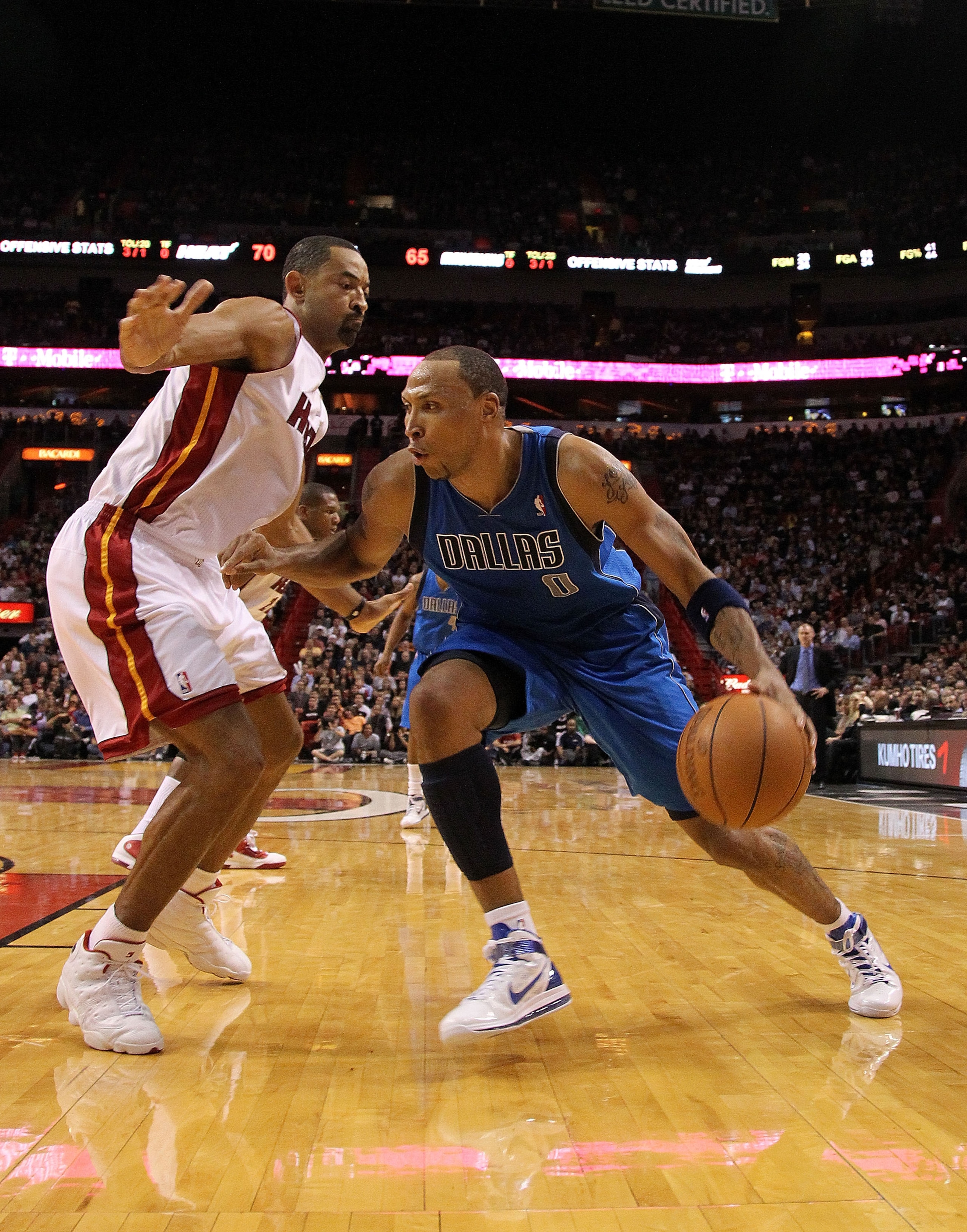 MIAMI, FL - DECEMBER 20:  Shawn Marion #0 of the Dallas Mavericks dribbles against Juwan Howard #5 of the Miami Heat during a game at American Airlines Arena on December 20, 2010 in Miami, Florida. NOTE TO USER: User expressly acknowledges and agrees that