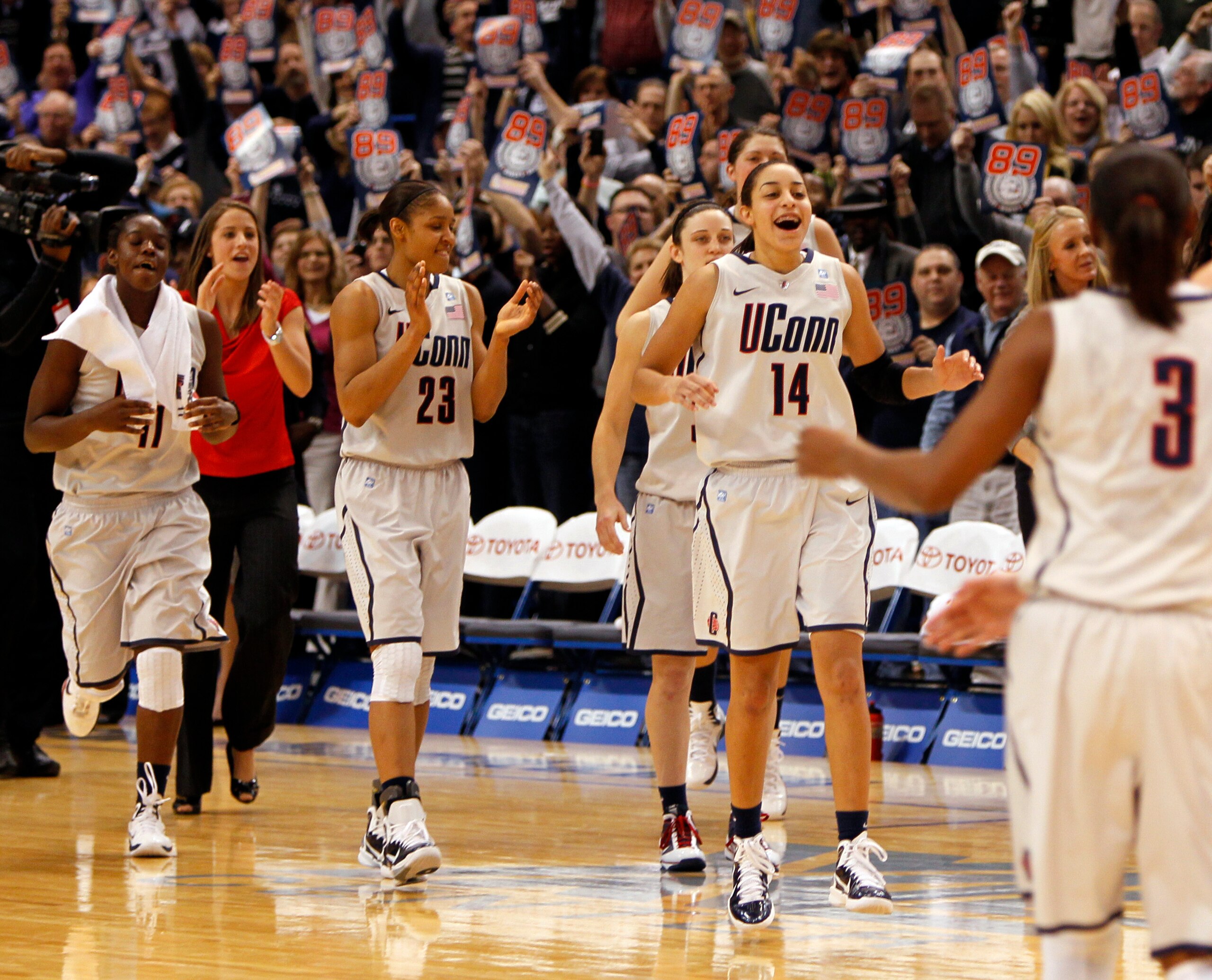 HARTFORD, CT - DECEMBER 21: Samarie Walker #11, Maya Moore #23 and Bria Hartley #14 of the Connecticut celebrate a win over Florida State on December 21, 2010 in Hartford, Connecticut. Connecticut set a record with 89 straight wins without a defeat. (Ph HARTFORD, CT - DECEMBER 21: Samarie Walker #11, Maya Moore #23 and Bria Hartley #14 of the Connecticut celebrate a win over Florida State on December 21, 2010 in Hartford, Connecticut. Connecticut set a record with 89 straight wins without a defeat. (Ph