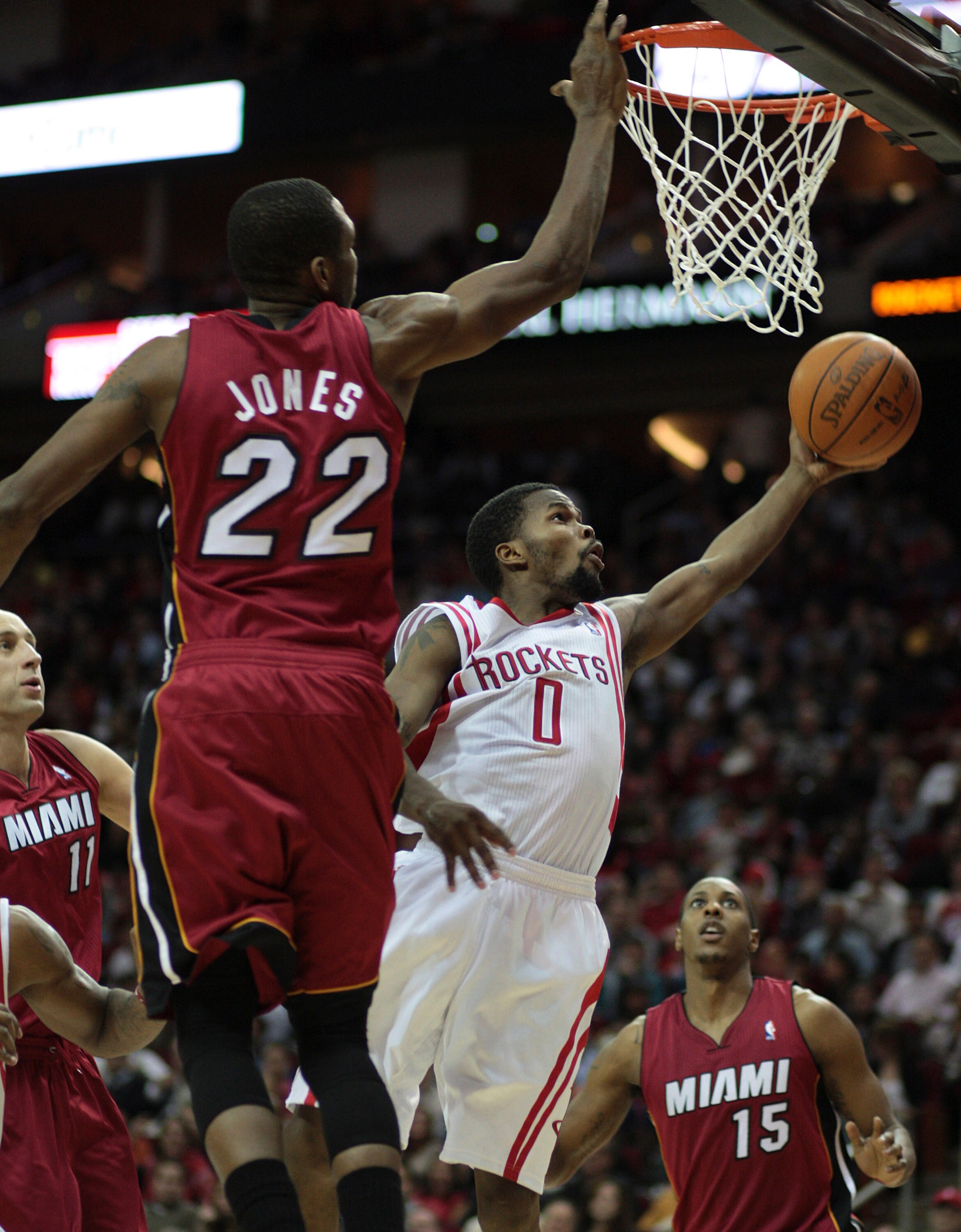 HOUSTON - DECEMBER 29: Aaron Brooks #0 of the Houston Rockets drives to the basket past James Jones #22 of the Miami Heat at Toyota Center on December 29, 2010 in Houston, Texas.  (Photo by Bob Levey/Getty Images)
