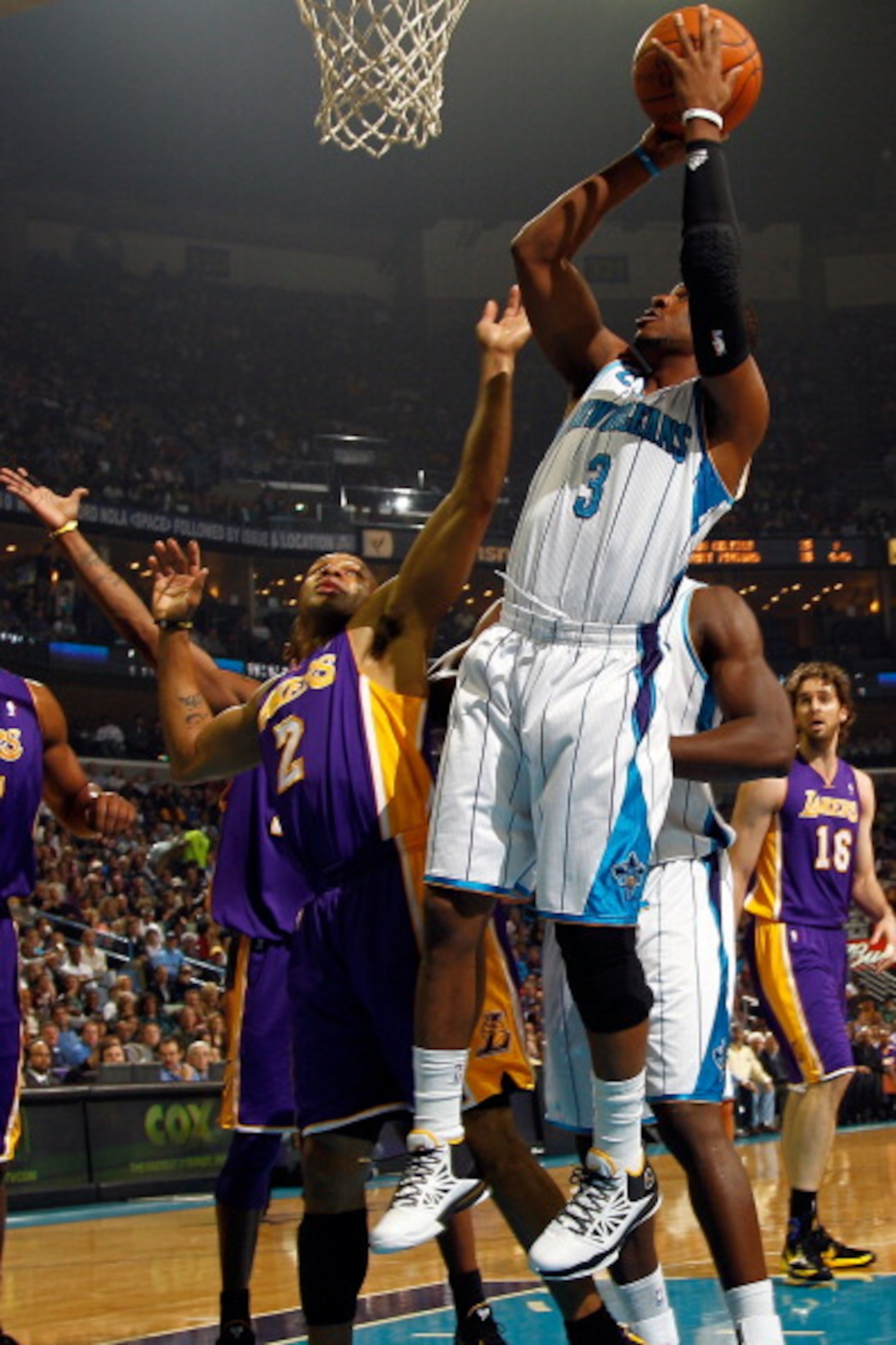 NEW ORLEANS, LA - DECEMBER 29:  Chris Paul #3 of the New Orleans Hornets shoots the ball over Derek Fisher #2 of the Los Angeles Lakers at the New Orleans Arena on December 29, 2010 in New Orleans, Louisiana.   NOTE TO USER: User expressly acknowledges an