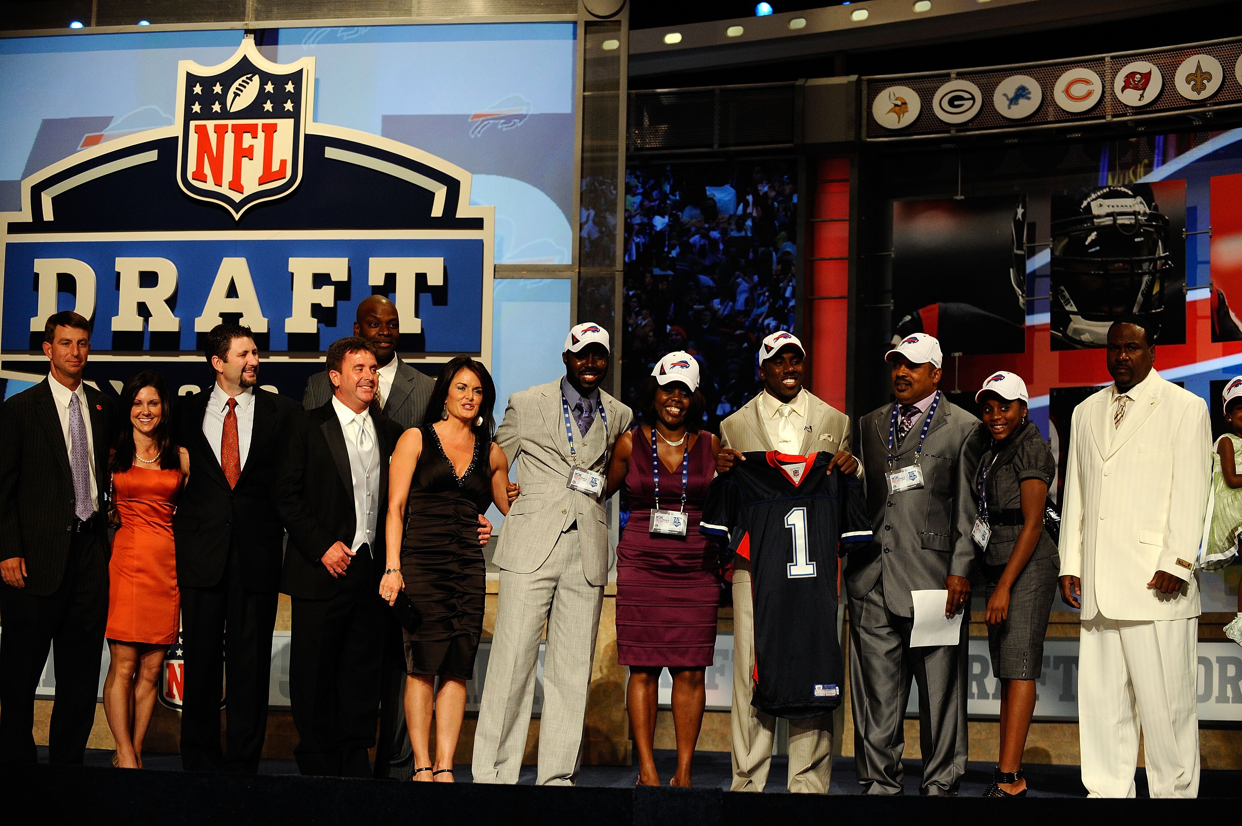 NEW YORK - APRIL 22:  C.J. Spiller from the Clemson Tigers holds up a Buffalo Bills jersey as he poses with friends and family after he was selected number 9 overall by the Bills during the first round of the 2010 NFL Draft at Radio City Music Hall on Apr