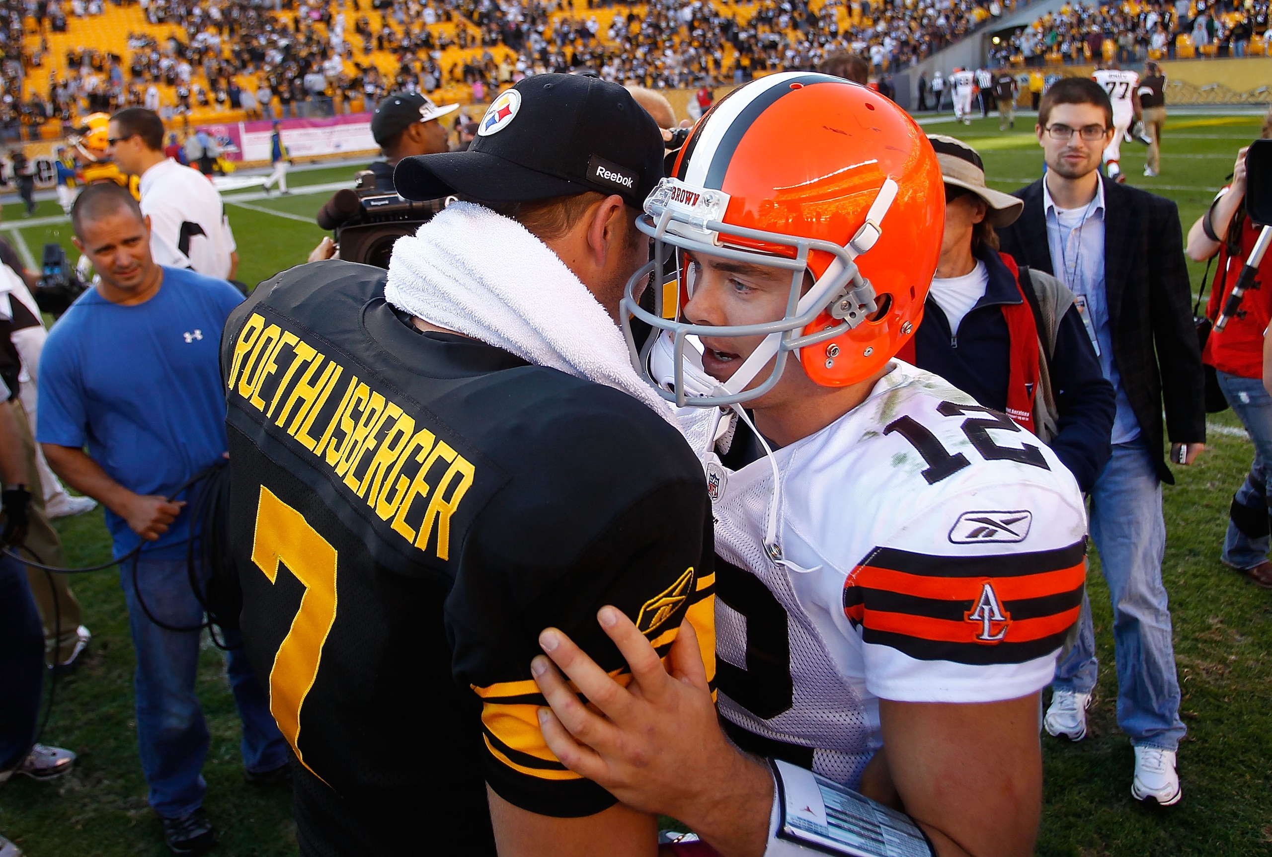 PITTSBURGH - OCTOBER 17:  Ben Roethlisberger #7 of the Pittsburgh Steelers talks to Colt McCoy #12 of the Cleveland Browns after defeating the Cleveland Browns 28-10 on October 17, 2010 at Heinz Field in Pittsburgh, Pennsylvania.  (Photo by Jared Wickerha