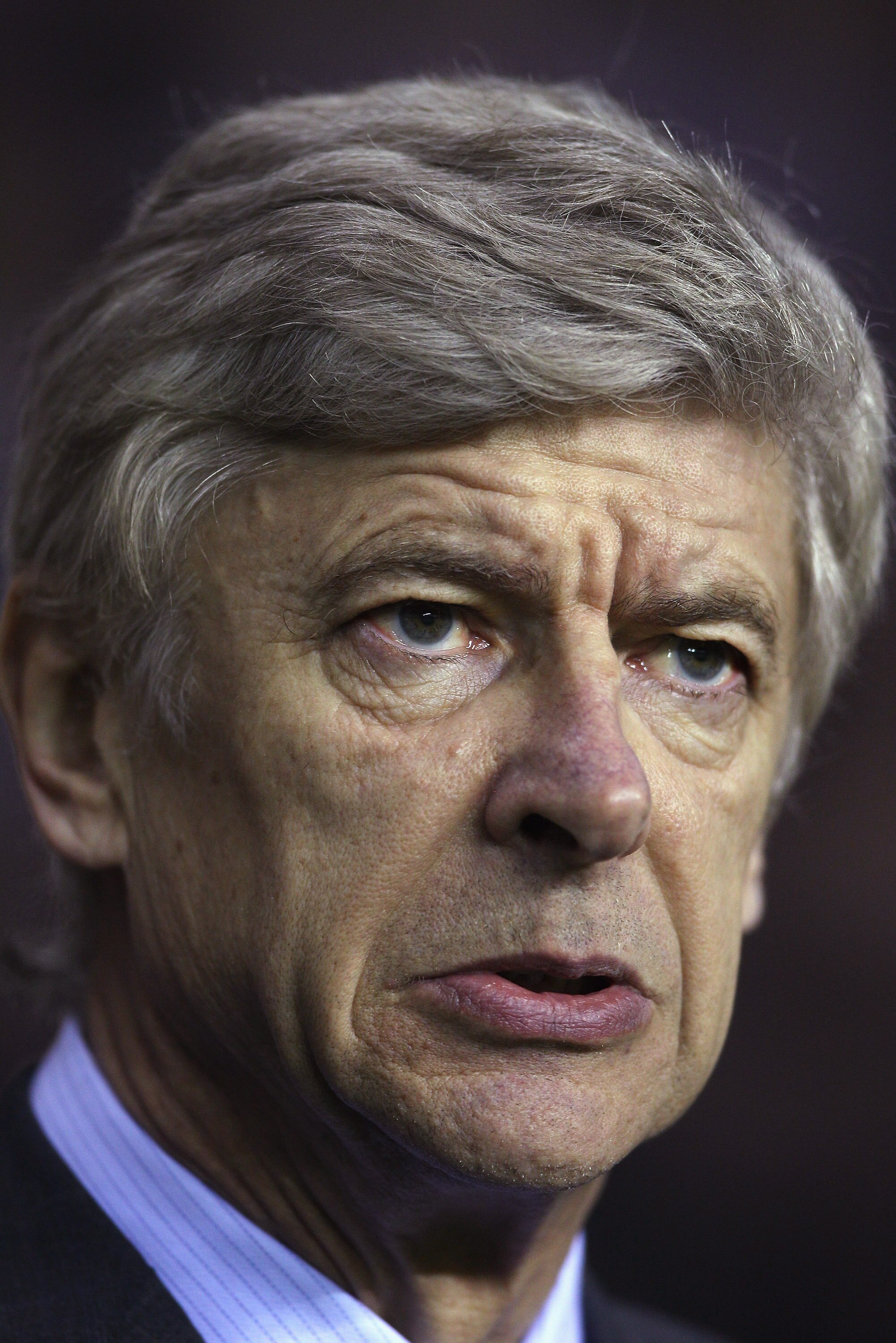 WIGAN, ENGLAND - DECEMBER 29:  Arsene Wenger coach of Arsenal looks on during the Barclays Premier League match between Wigan Athletic and Arsenal at DW Stadium on December 29, 2010 in Wigan, England.  (Photo by Michael Steele/Getty Images)