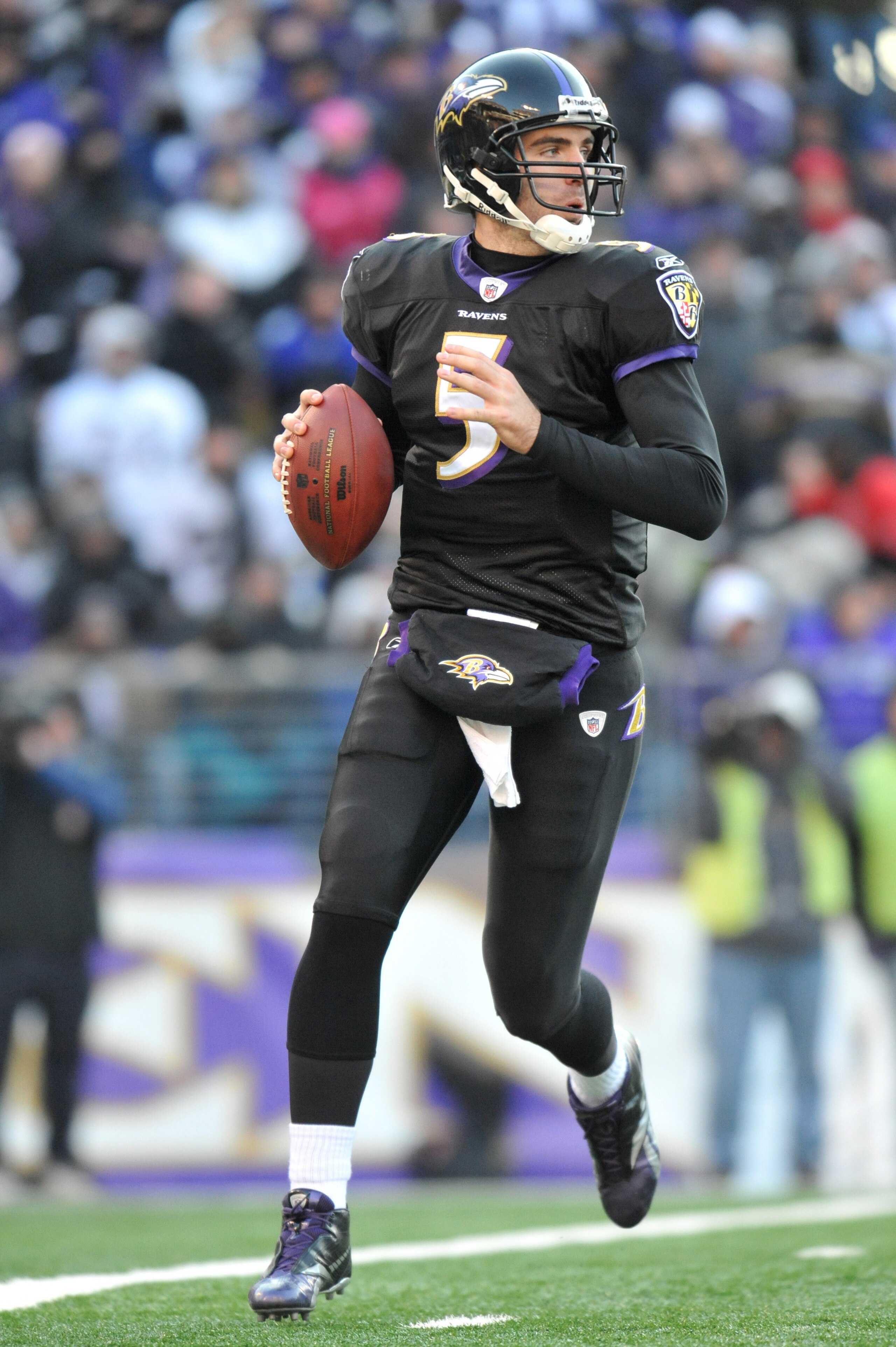 BALTIMORE, MD - DECEMBER 19:  Joe Flacco #5 of the Baltimore Ravens looks for a receiver during the game against the New Orleans Saints  at M&T Bank Stadium on December 19, 2010 in Baltimore, Maryland. The Ravens defeated the Saints 30-24. (Photo by Larry