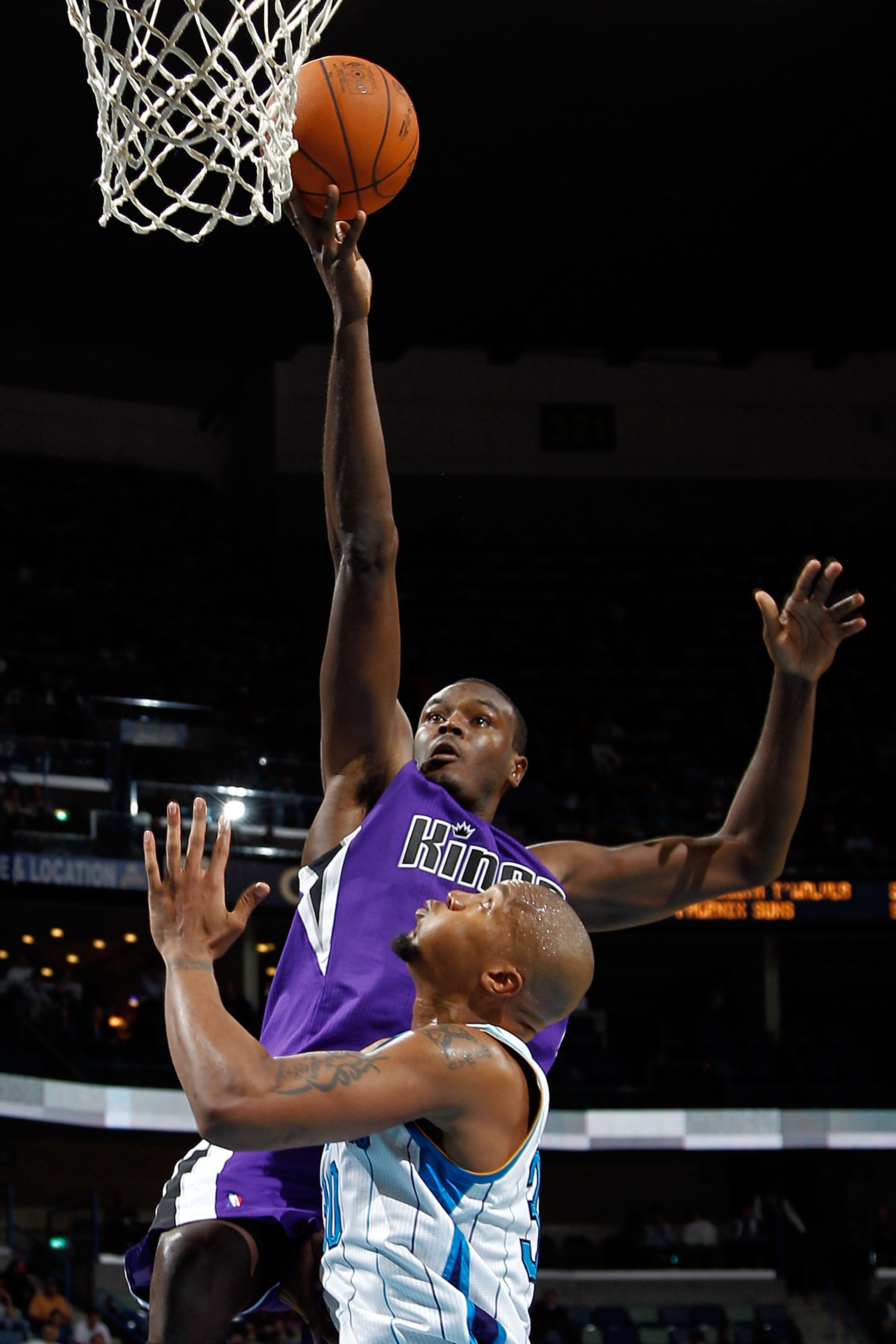 NEW ORLEANS, LA - DECEMBER 15: Samuel Dalembert #10 of the Sacramento Kings shoots the ball over David West #30 of the New Orleans Hornets at the New Orleans Arena on December 15, 2010 in New Orleans, Louisiana. NOTE TO USER: User expressly acknowledge NEW ORLEANS, LA - DECEMBER 15: Samuel Dalembert #10 of the Sacramento Kings shoots the ball over David West #30 of the New Orleans Hornets at the New Orleans Arena on December 15, 2010 in New Orleans, Louisiana. NOTE TO USER: User expressly acknowledge