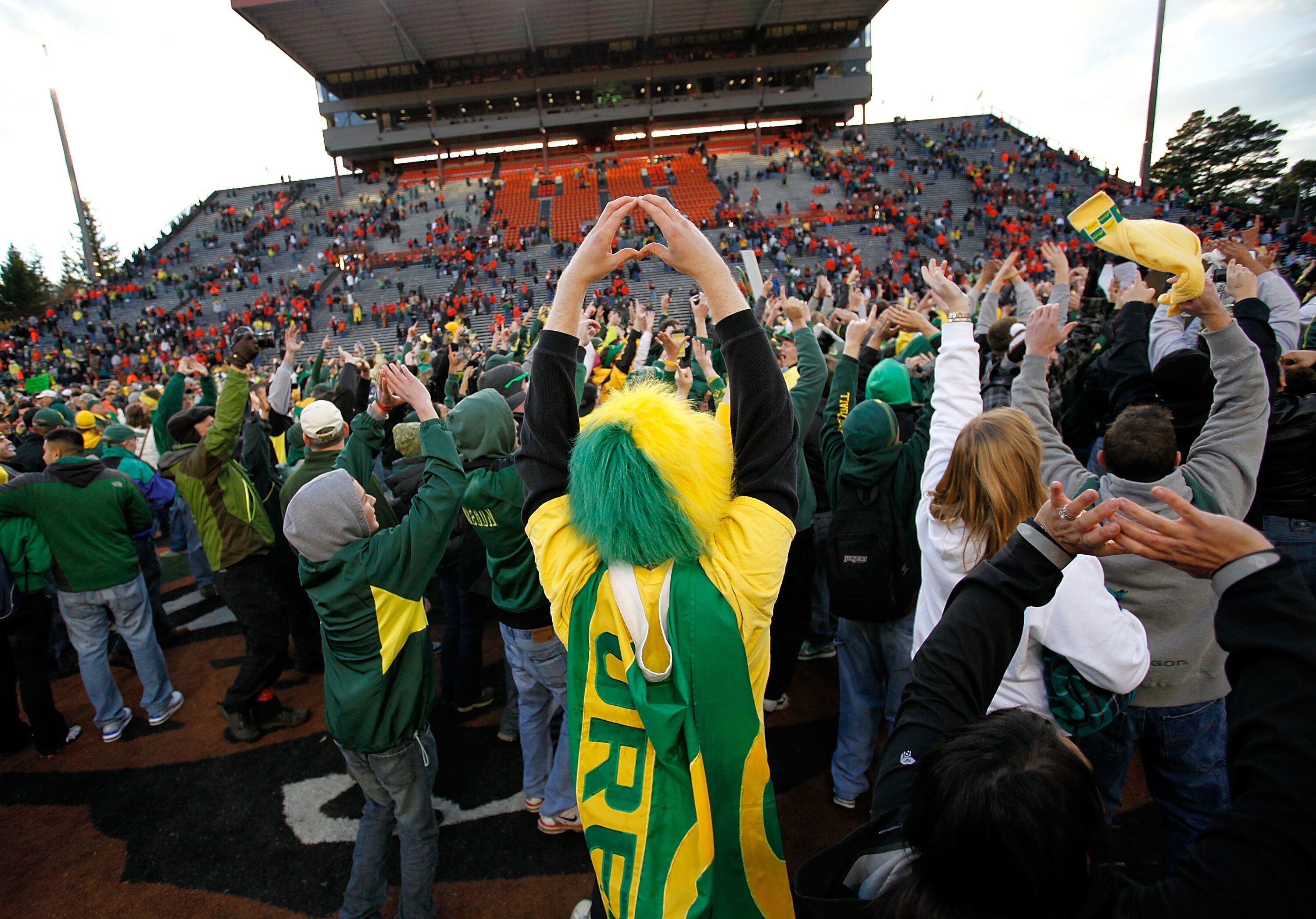 CORVALLIS, OR - DECEMBER 04:  Fans of the Oregon Ducks rush onto te field after te 37-20 victory over the Oregon State Beavers during the 114th Civil War on December 4, 2010 at the Reser Stadium in Corvallis, Oregon.  (Photo by Jonathan Ferrey/Getty Image