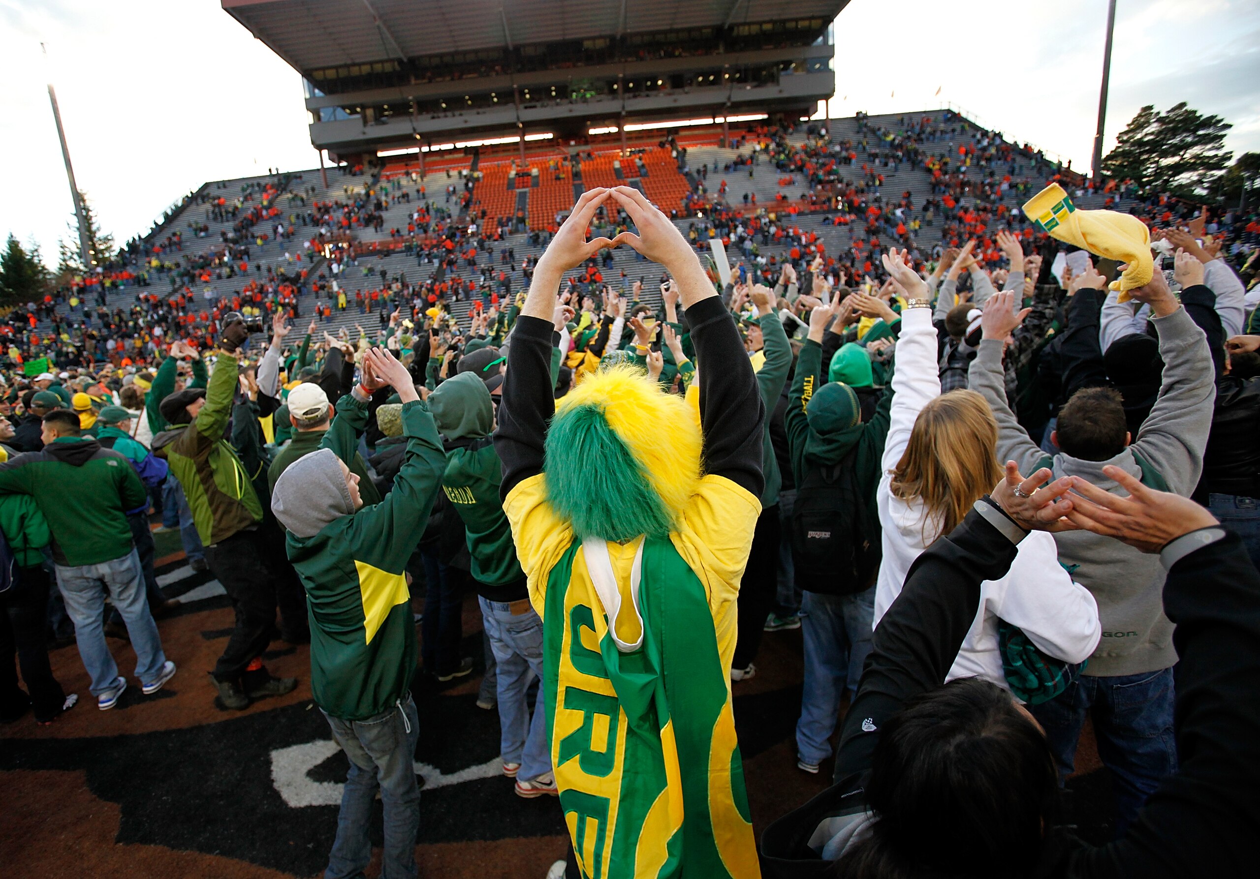 CORVALLIS, OR - DECEMBER 04:  Fans of the Oregon Ducks rush onto te field after te 37-20 victory over the Oregon State Beavers during the 114th Civil War on December 4, 2010 at the Reser Stadium in Corvallis, Oregon.  (Photo by Jonathan Ferrey/Getty Image