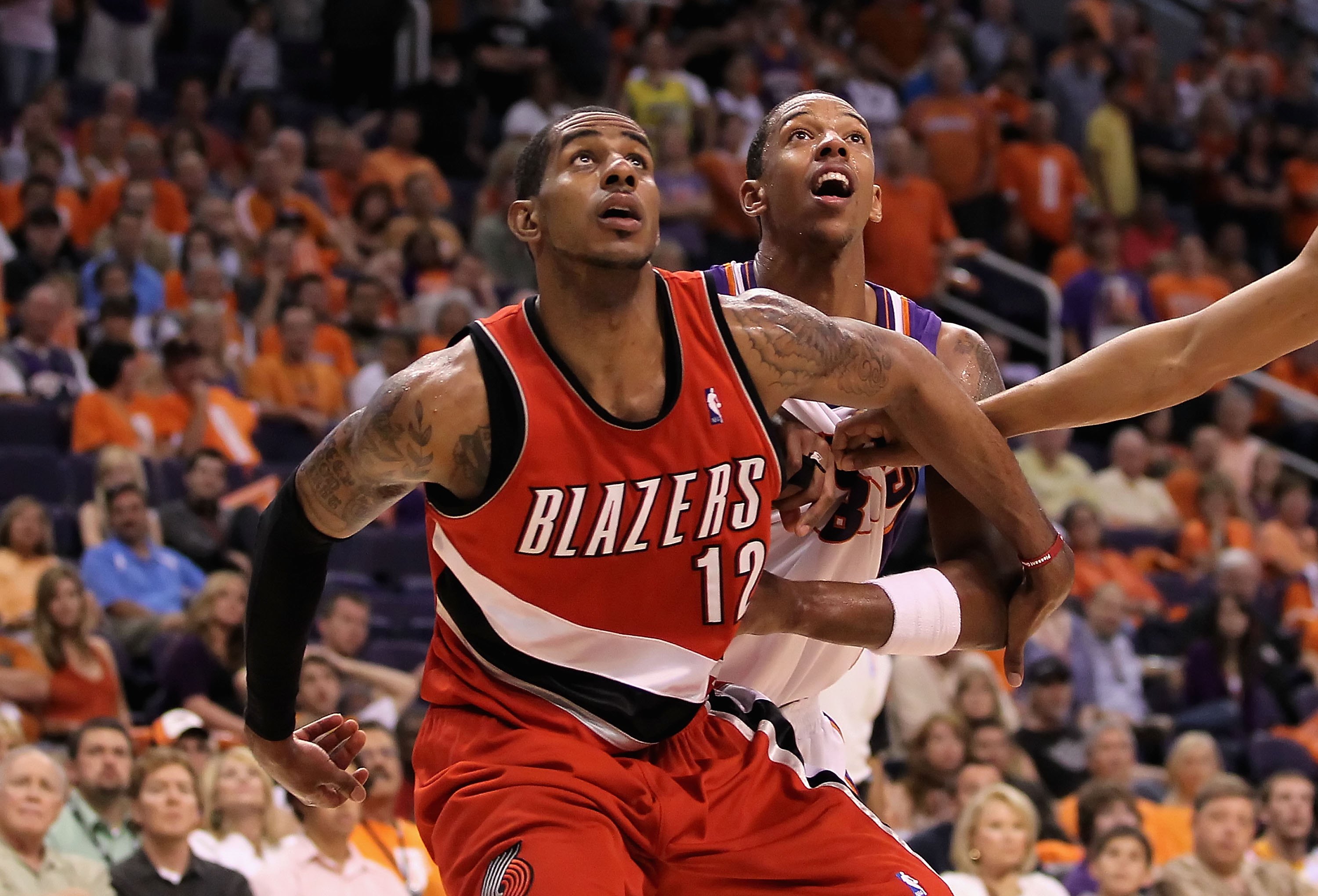 PHOENIX - APRIL 18:  LaMarcus Aldridge #12 of the Portland Trail Blazers blocks out Channing Frye #8 of the Phoenix Suns during Game One of the Western Conference Quarterfinals of the 2010 NBA Playoffs at US Airways Center on April 18, 2010 in Phoenix, Ar