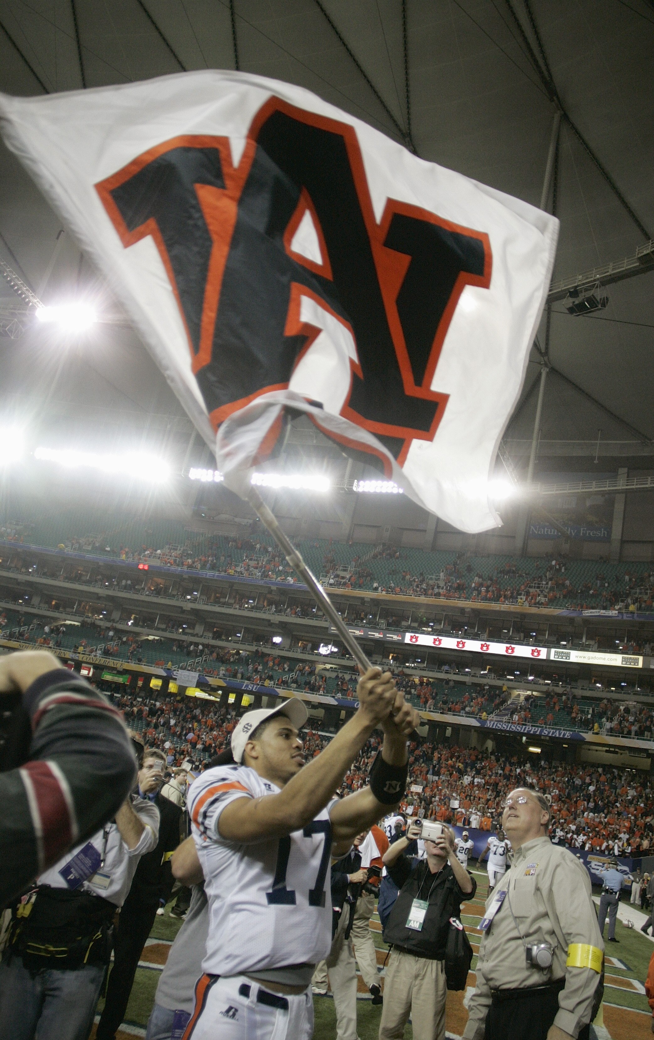 ATLANTA, GA - DECEMBER 4:  Quarterback Jason Campbell #17 of the Auburn Tigers waves his school flag after facing the Tennessee Volunteers in the 2004 SEC Championship Game at the Georgia Dome on December 4, 2004 in Atlanta, Georgia. Auburn defeated Tenne
