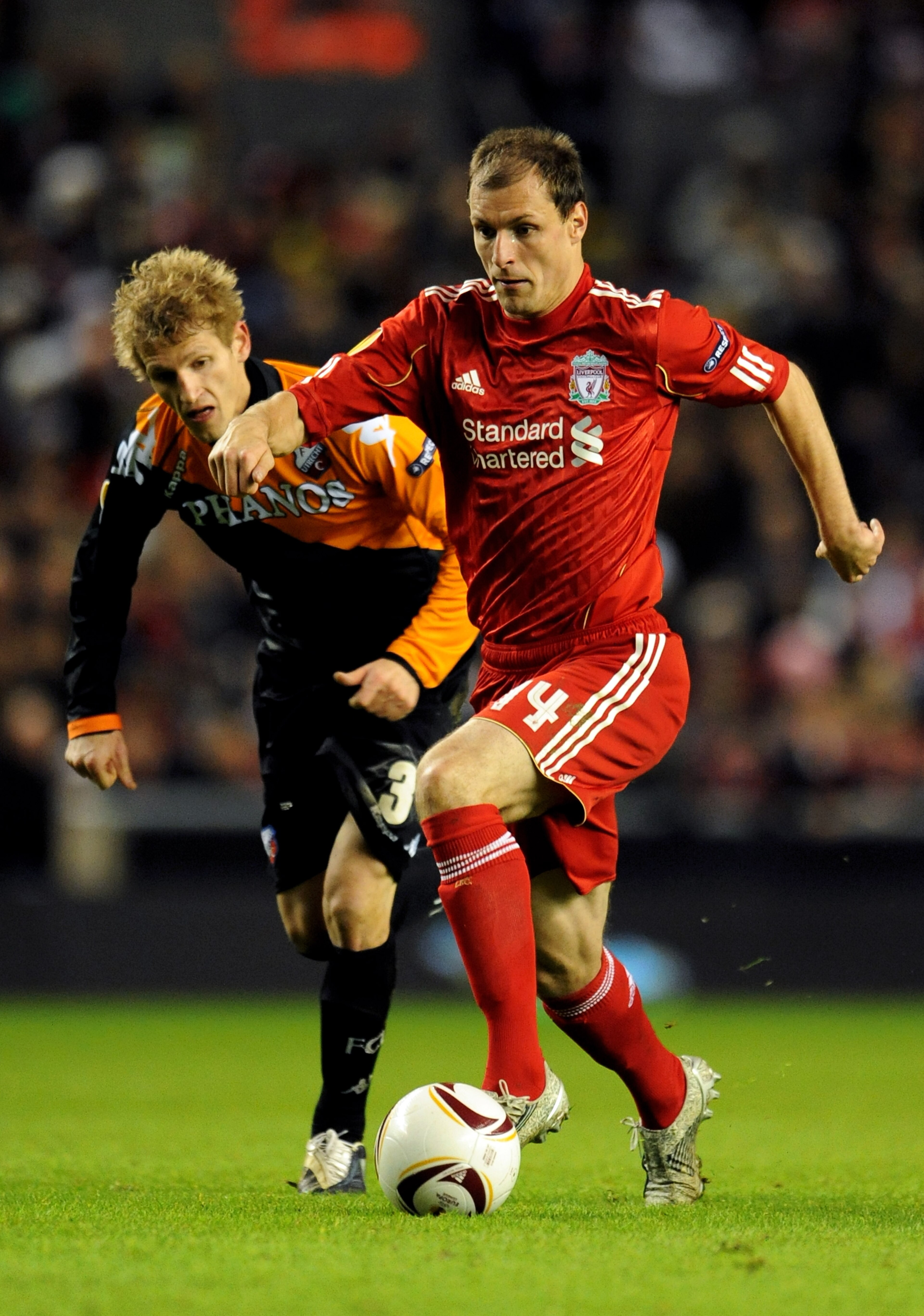 LIVERPOOL, ENGLAND - DECEMBER 15: Milan Jovanovic of Liverpool is pursued by Mihai Nesu of FC Utrecht during the UEFA Europa League Group K match between Liverpool and FC Utrecht at Anfield on December 15, 2010 in Liverpool, England. (Photo by Clint Hug LIVERPOOL, ENGLAND - DECEMBER 15: Milan Jovanovic of Liverpool is pursued by Mihai Nesu of FC Utrecht during the UEFA Europa League Group K match between Liverpool and FC Utrecht at Anfield on December 15, 2010 in Liverpool, England. (Photo by Clint Hug