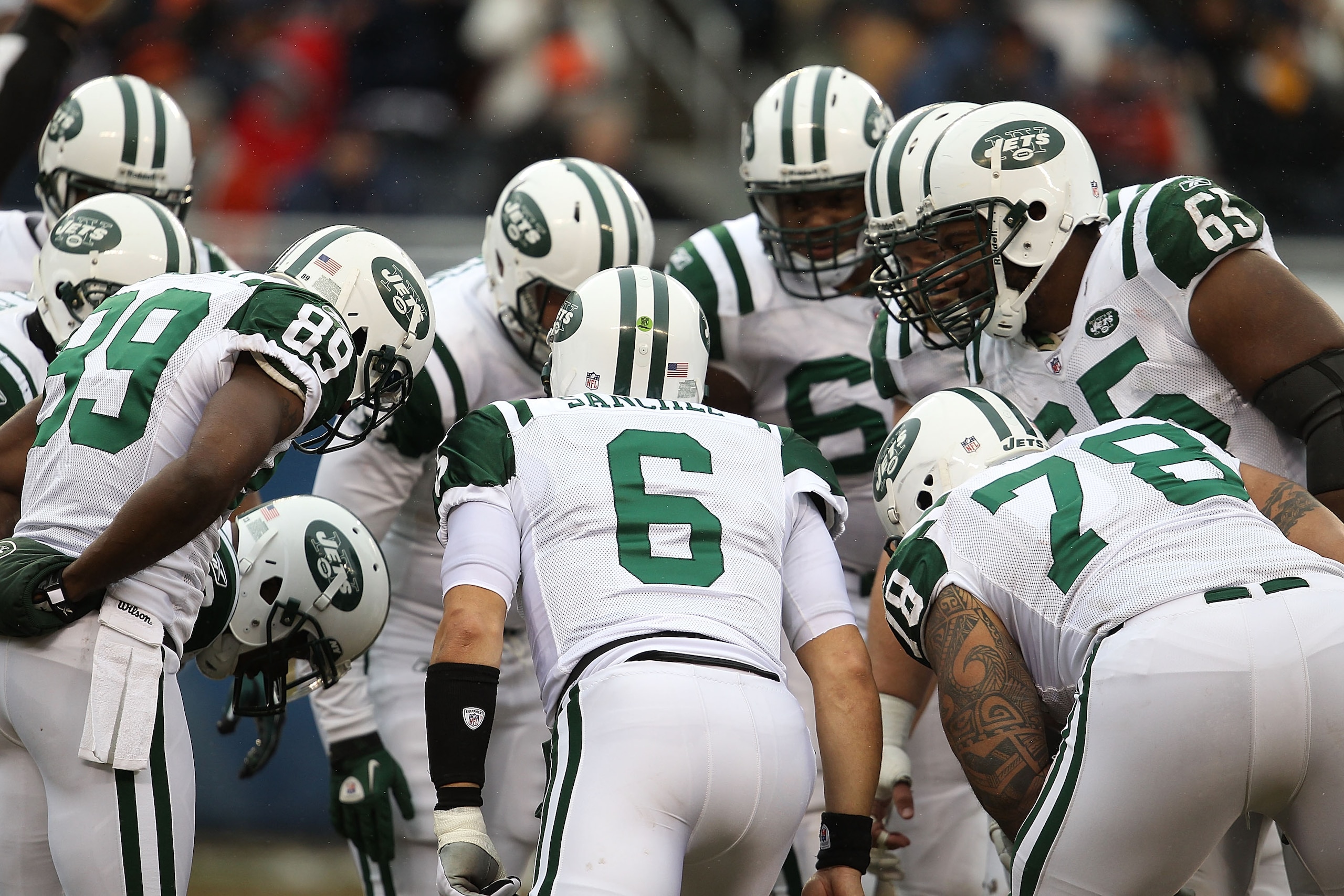 CHICAGO, IL - DECEMBER 26: Mark Sanchez #6 of the New York Jets calls a play in the huddle against the Chicago Bears at Soldier Field on December 26, 2010 in Chicago, Illinois. The Bears defeated the Jets 38-34. (Photo by Jonathan Daniel/Getty Images)
