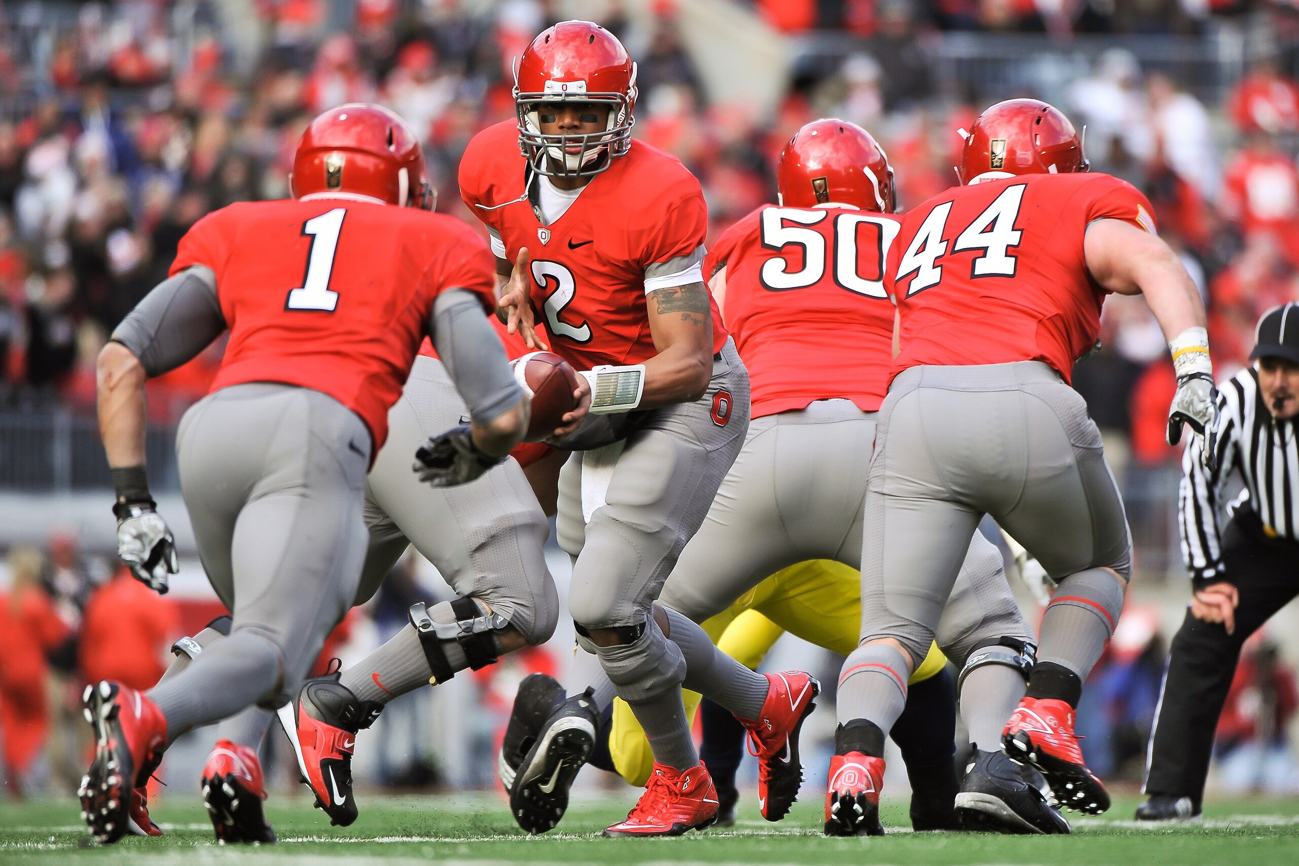 COLUMBUS, OH - NOVEMBER 27: Quarterback Terrelle Pryor #2 of the Ohio State Buckeyes hands off against the Michigan Wolverines at Ohio Stadium on November 27, 2010 in Columbus, Ohio. (Photo by Jamie Sabau/Getty Images) COLUMBUS, OH - NOVEMBER 27: Quarterback Terrelle Pryor #2 of the Ohio State Buckeyes hands off against the Michigan Wolverines at Ohio Stadium on November 27, 2010 in Columbus, Ohio. (Photo by Jamie Sabau/Getty Images)