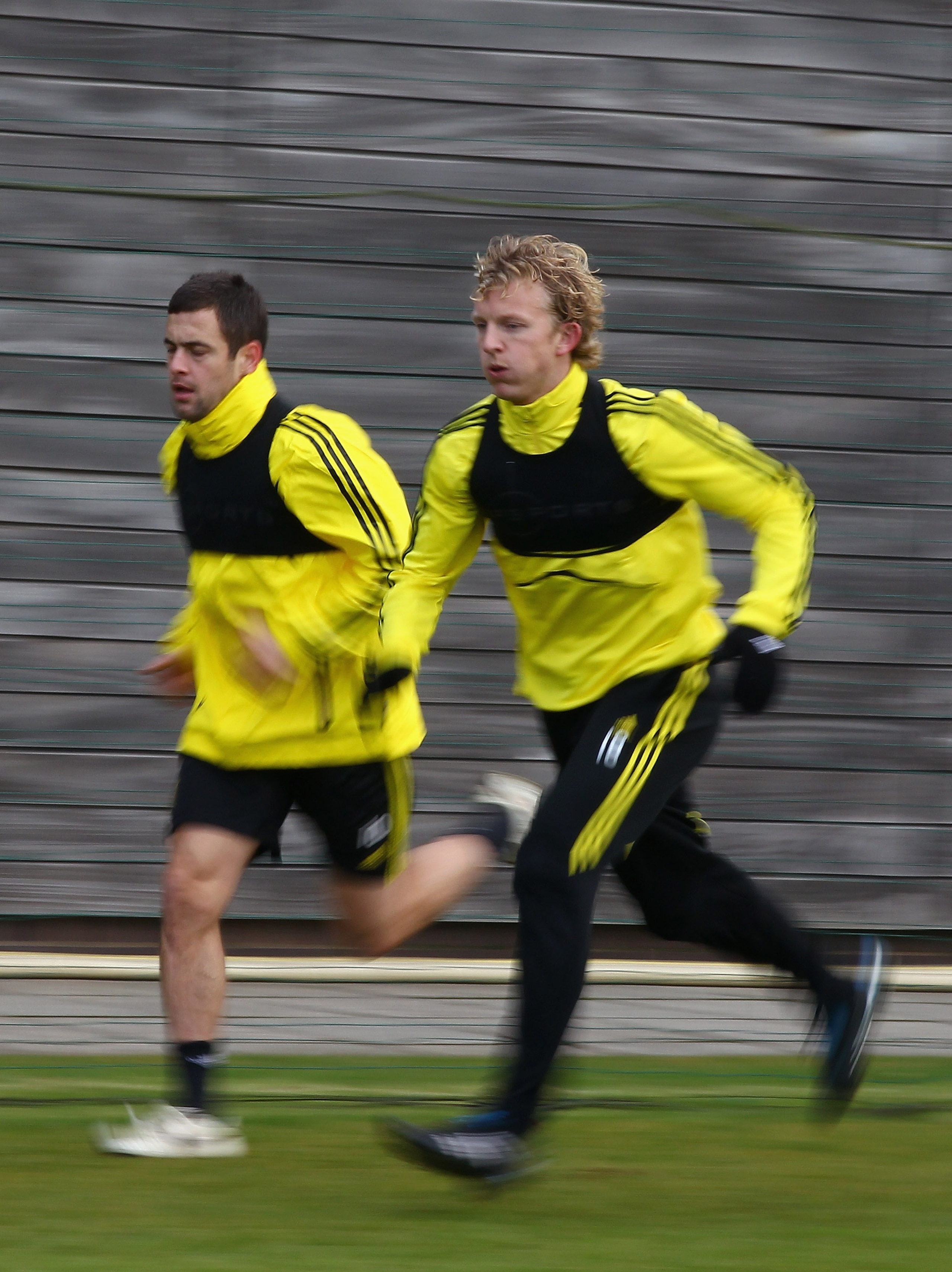 LIVERPOOL, ENGLAND - DECEMBER 14: Dirk Kuyt and Joe Cole of Liverpool in action during a training session ahead of their UEFA Europa League Group K match against Utrecht at Melwood Training Ground on December 14, 2010 in Liverpool, England.  (Photo by Cli