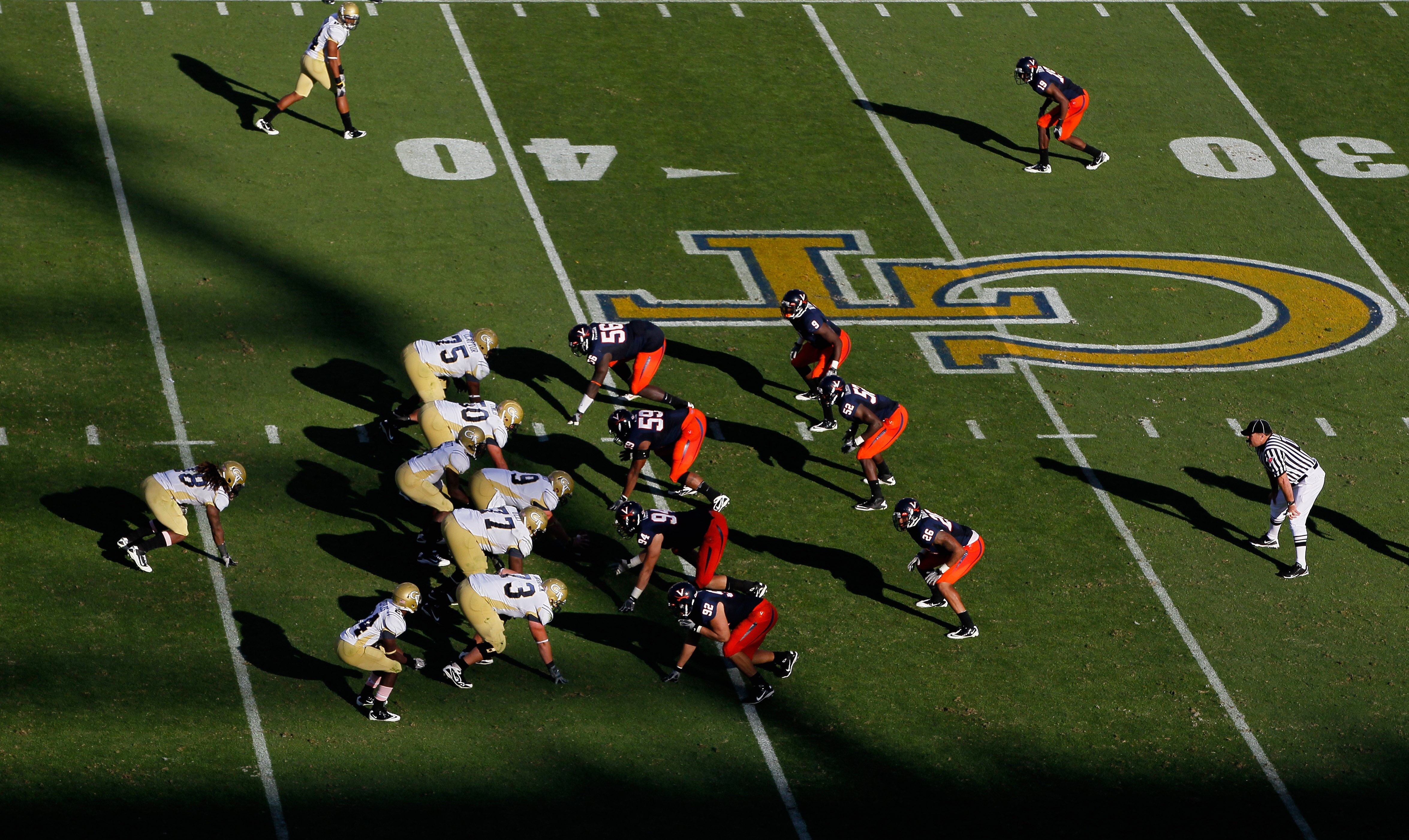 ATLANTA - OCTOBER 09:  The offense of the Georgia Tech Yellow Jackets against the defense of the Virginia Cavaliers at Bobby Dodd Stadium on October 9, 2010 in Atlanta, Georgia.  (Photo by Kevin C. Cox/Getty Images)
