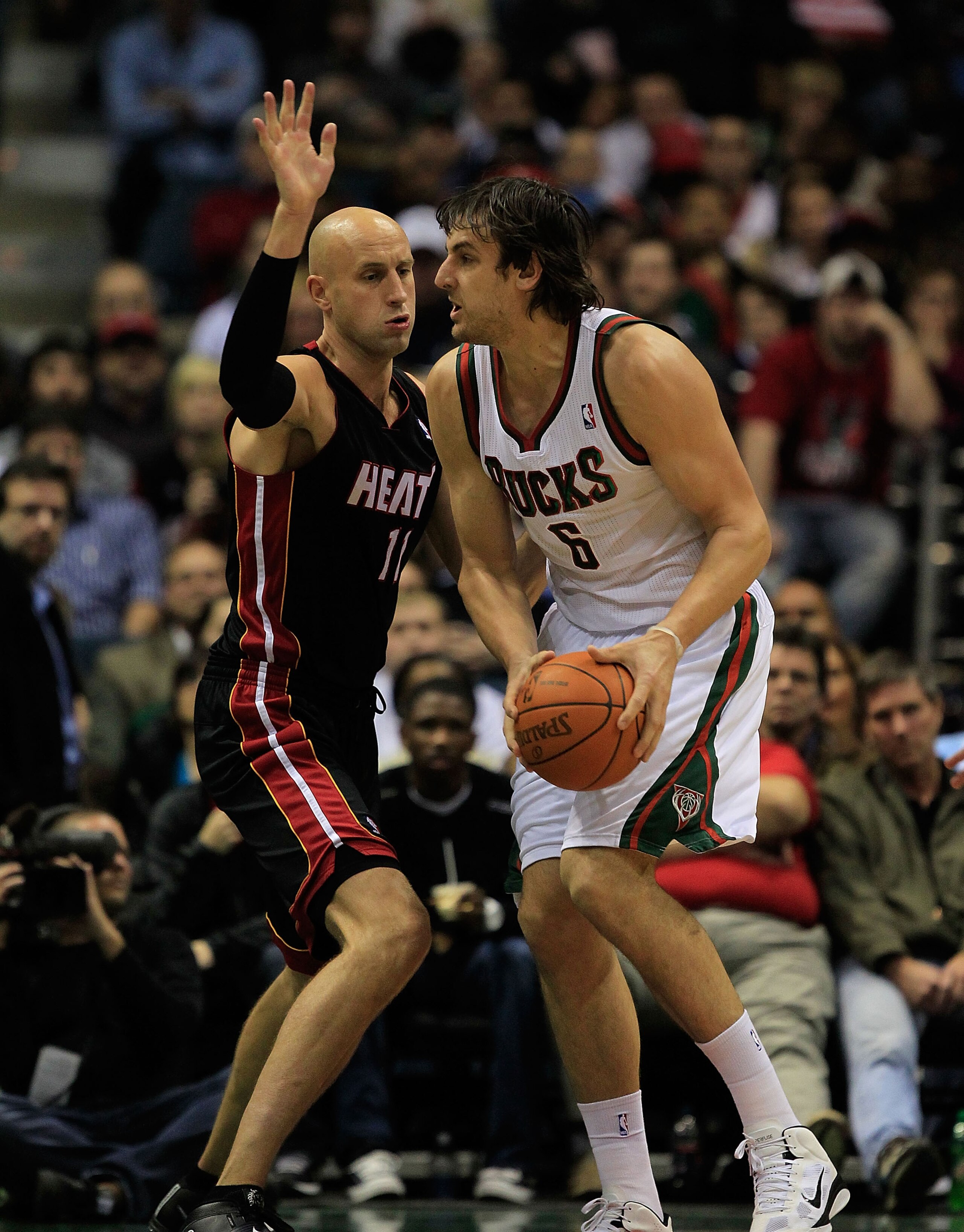 MILWAUKEE, WI - DECEMBER 06: Andrew Bogut #6 of the Milwaukee Bucks moves against Zydrunas Ilgauskas #11 of the Miami Heat at the Bradley Center on December 6, 2010 in Milwaukee, Wisconsin. The Heat defeated the Bucks 88-78. NOTE TO USER: User expressly a